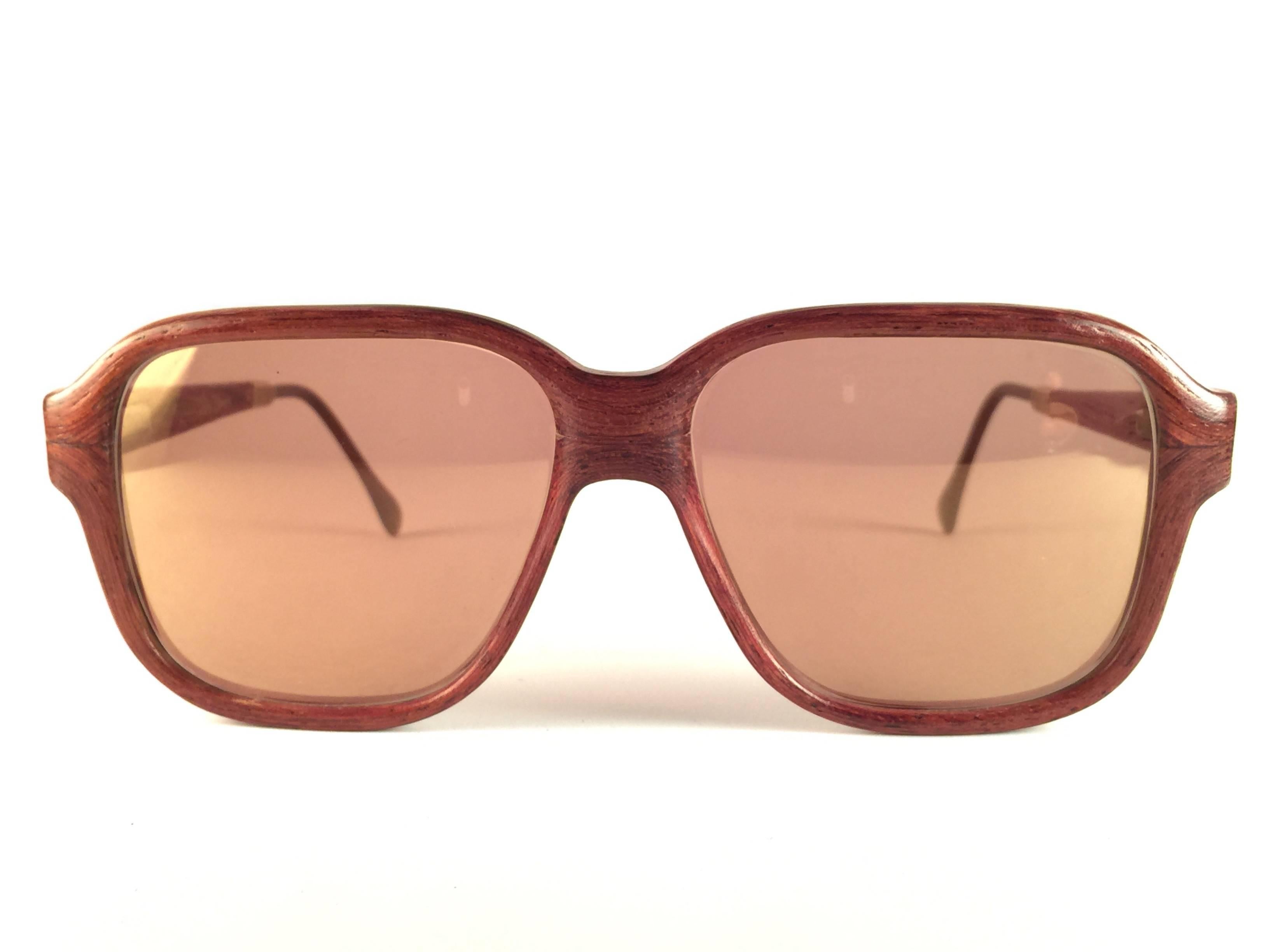 New Vintage Wood Look Paris genuine wood frame holding a pair of gold mirror lenses. 

New, never worn or displayed. This pair may have minor sign of wear due to storage. 

Made in France.