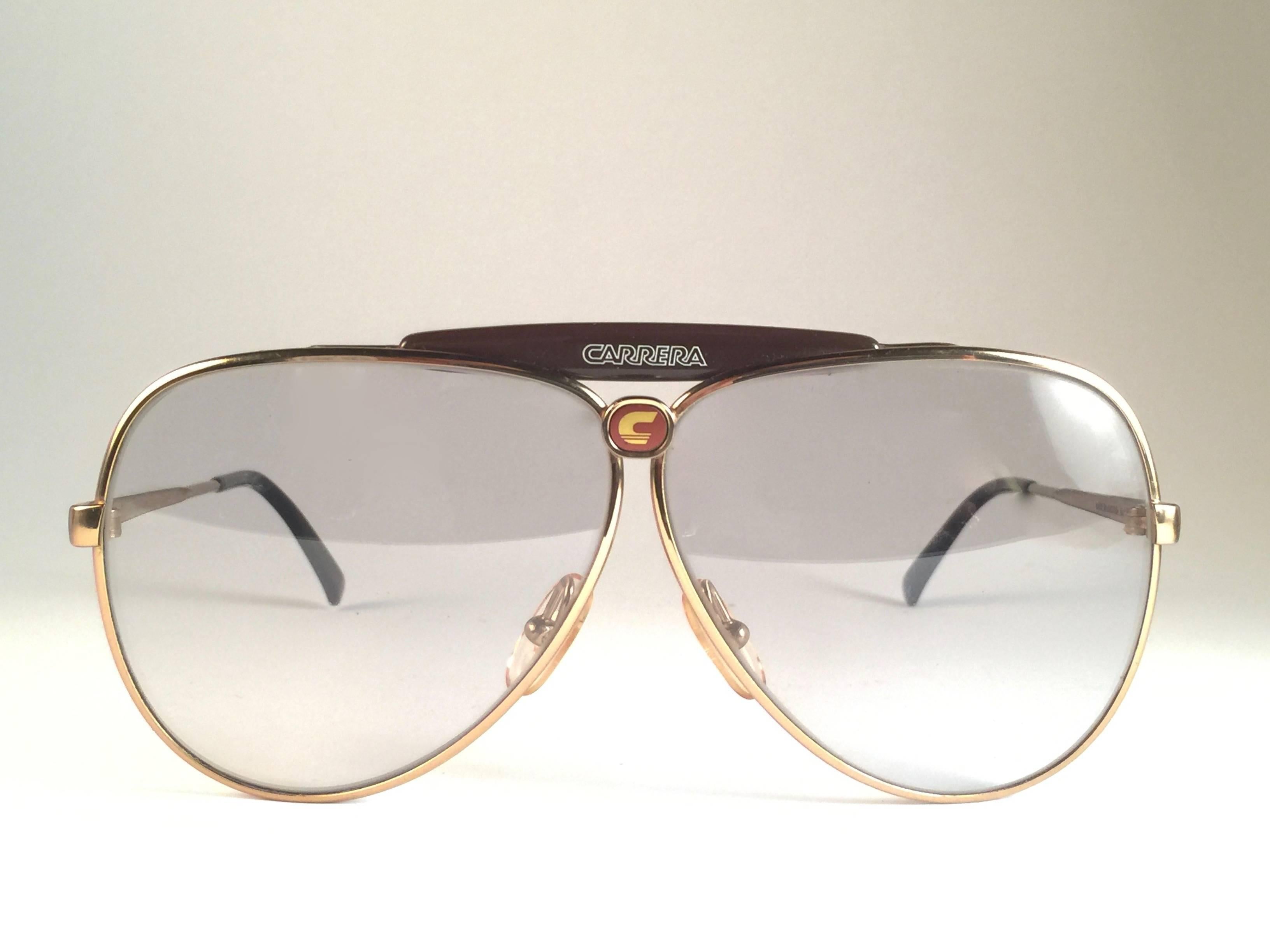 New 1970's Carrera aviator frame with light / clear lenses.  

Amazing craftsmanship and quality.   

Comes with the original black Carrera hard case thats has some wear on it due to nearly 40 years of storage.   

New, never worn. Made in Austria.