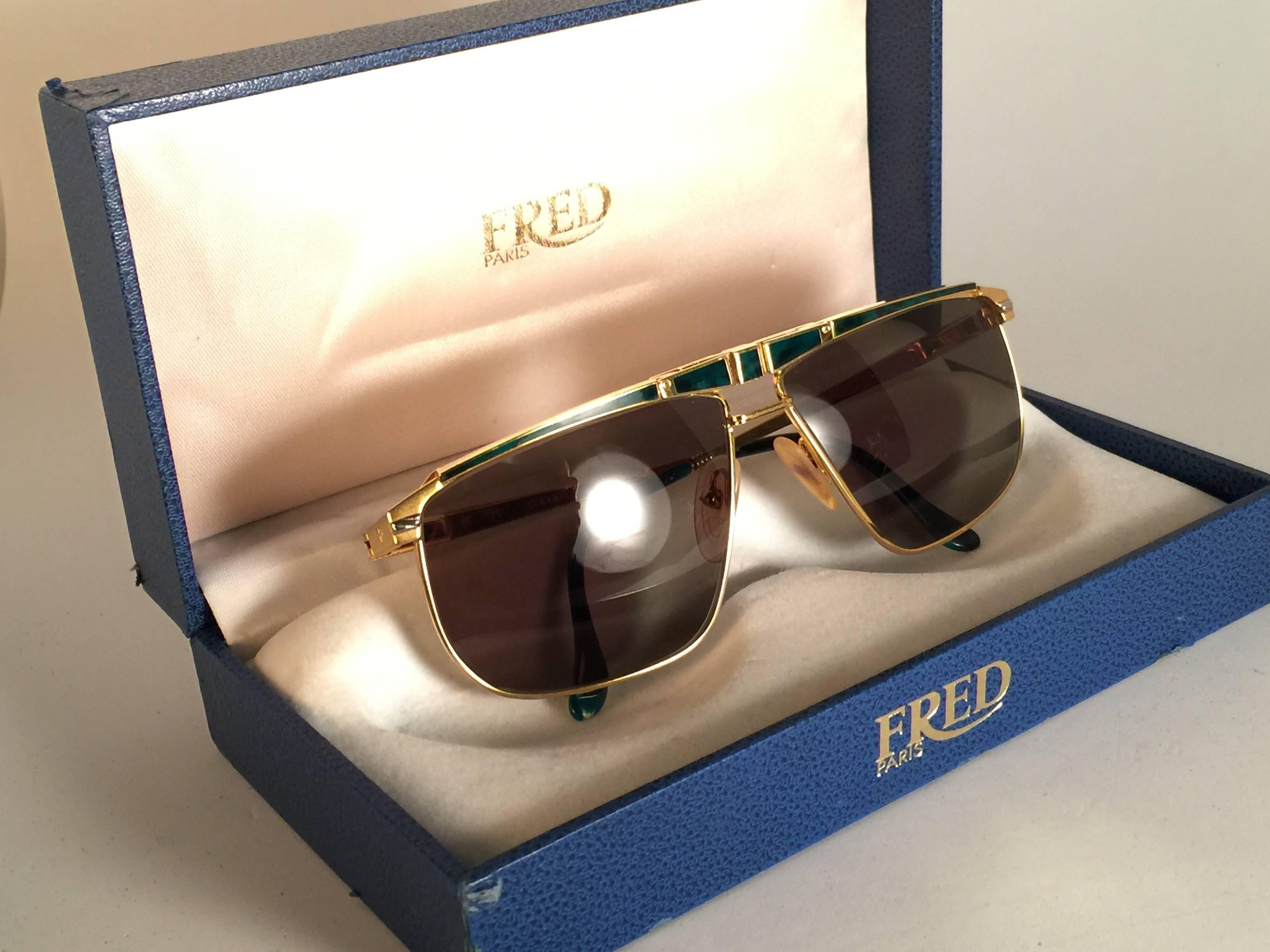 Rare Fred Ocean sunglasses. 
Beautiful detailed frame with Jade inserts holding pair of dark green lenses.  This pair may show minor sign of wear due to storage. 
Original Fred box with soft inside padding. This box have sign of wear.
Made in France.