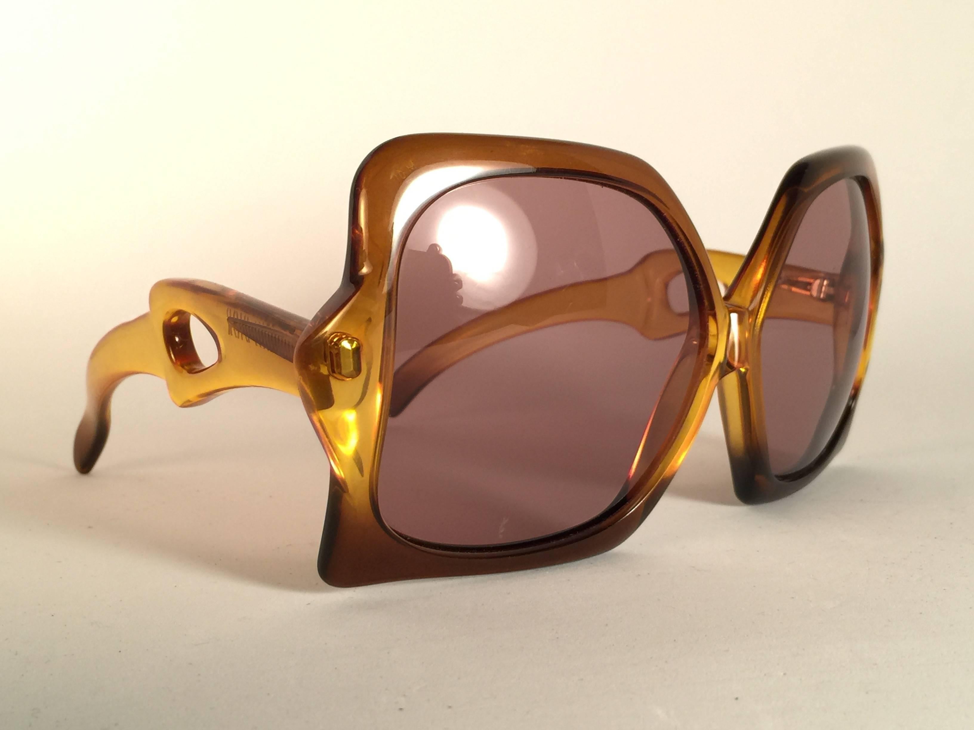 New Vintage Miss Dior two tone amber frame with spotless lenses. Made in Austria.  Produced and design in 1970's.  A collector’s piece! New, never worn or displayed. It has light wear due to 40 years of storage.