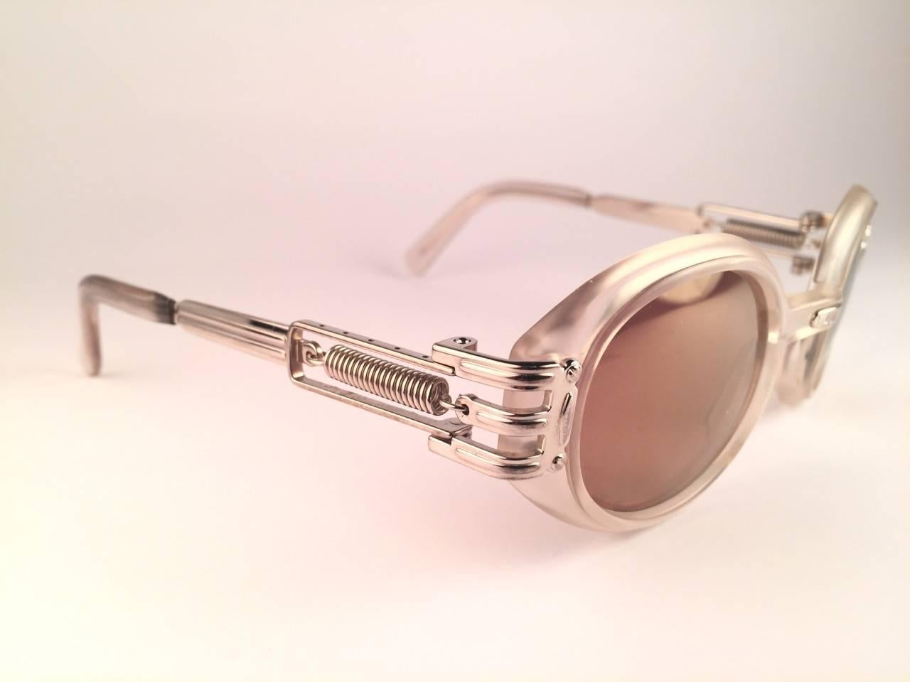 New Jean Paul Gaultier 56 5203 Translucent & Silver frame. 
Spotless Amber Mirror lenses that complete a ready to wear JPG look.

Amazing design with strong yet intricate details.
Design and produced in the 1900's.
New, never worn or displayed.
A