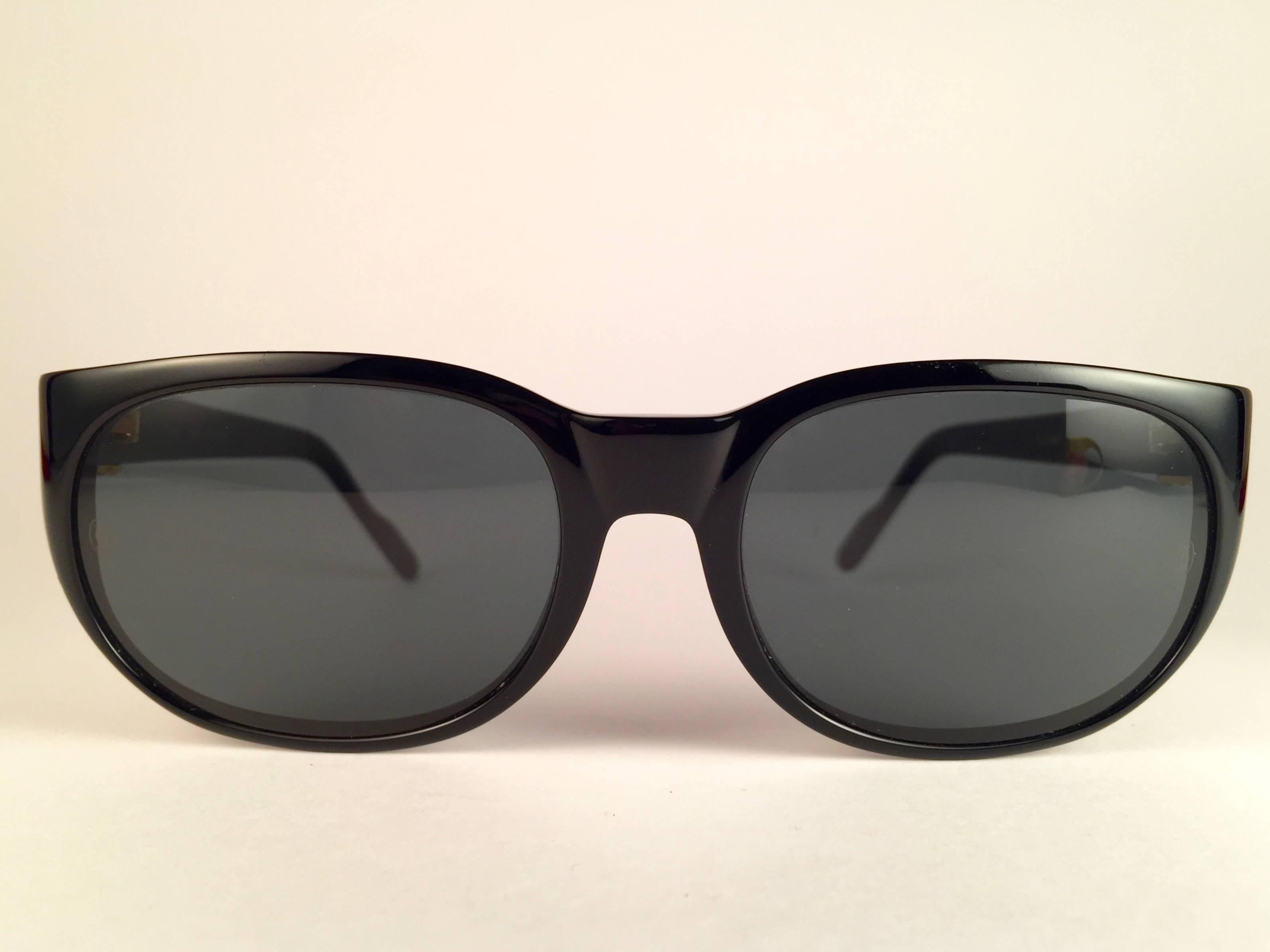 New, original Cartier classy Trinity sunglasses with G15 ( Grey ) (uv protection ) Cartier lenses. 
Frame is black and has the famous real gold and white gold accents. 
All hallmarks. Both arms sport the famous gold trinity sign from Cartier on the