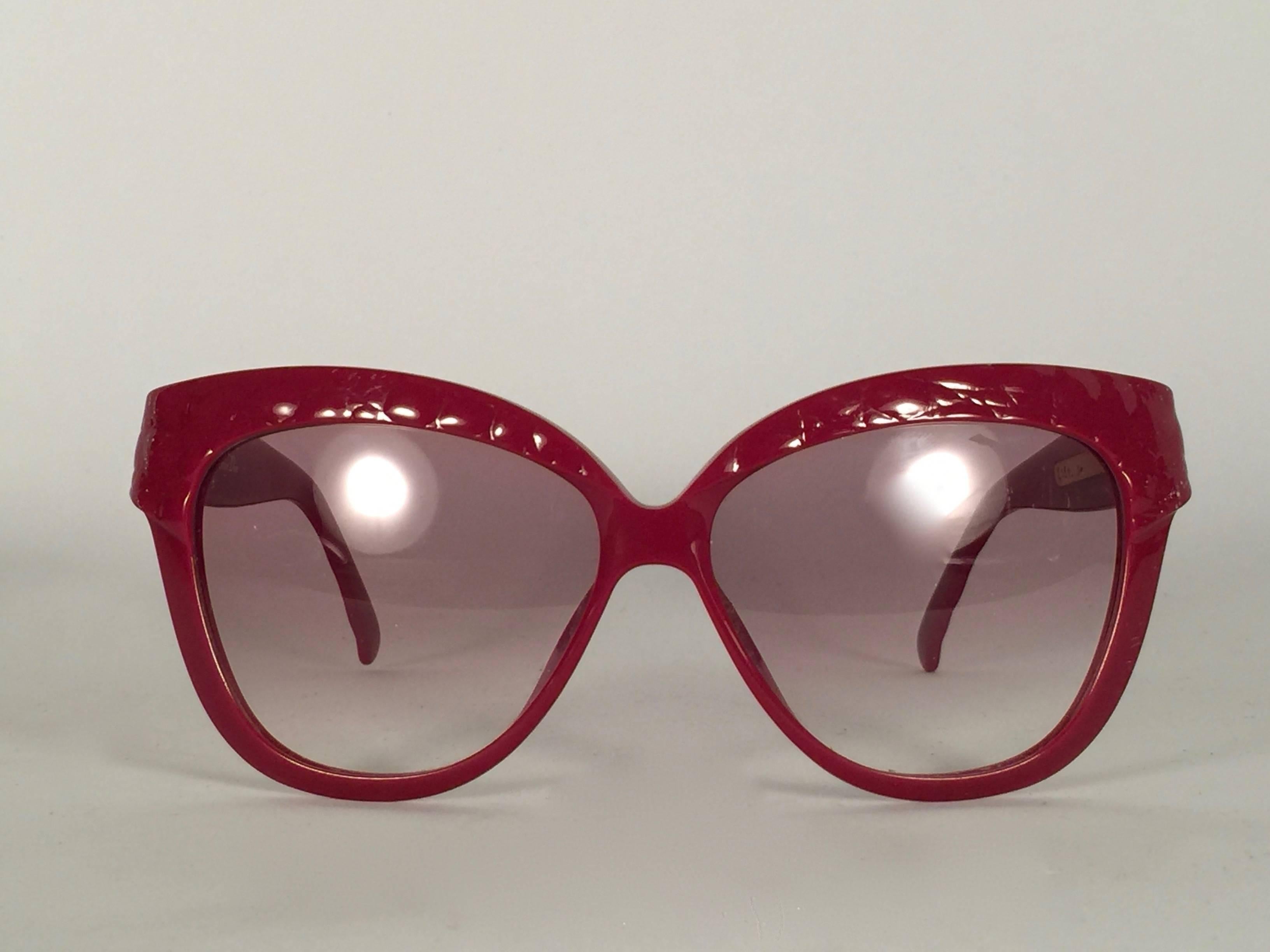 Mint Vintage Christian Dior 2321 quilted red frame with spotless light gradient lenses.   Made in Germany.  Produced and design in 1970's.  This item show minor sign of wear. Comes with its original silver Christian Dior Lunettes sleeve.
