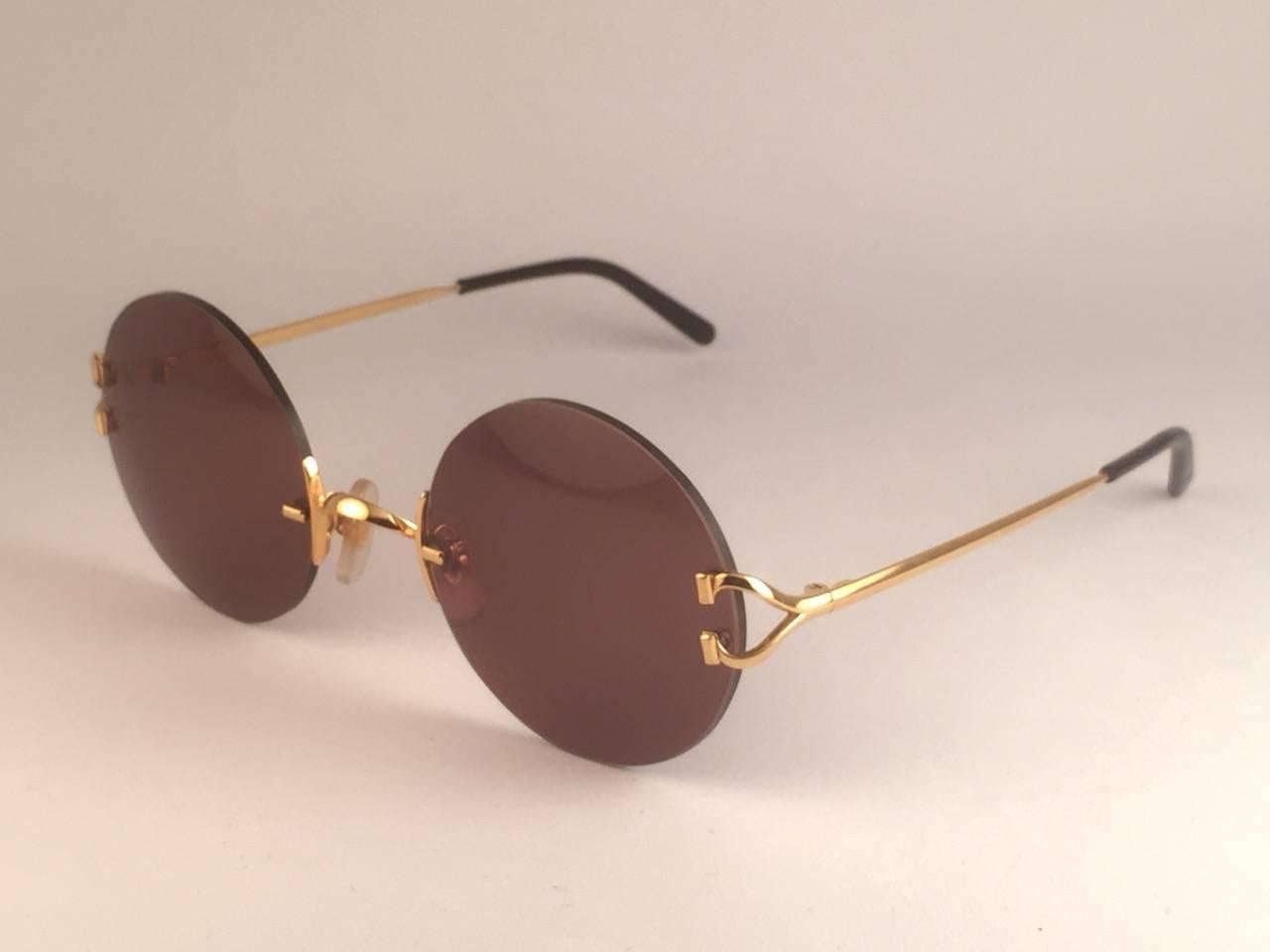 New Cartier Madison Round Rimless Gold 