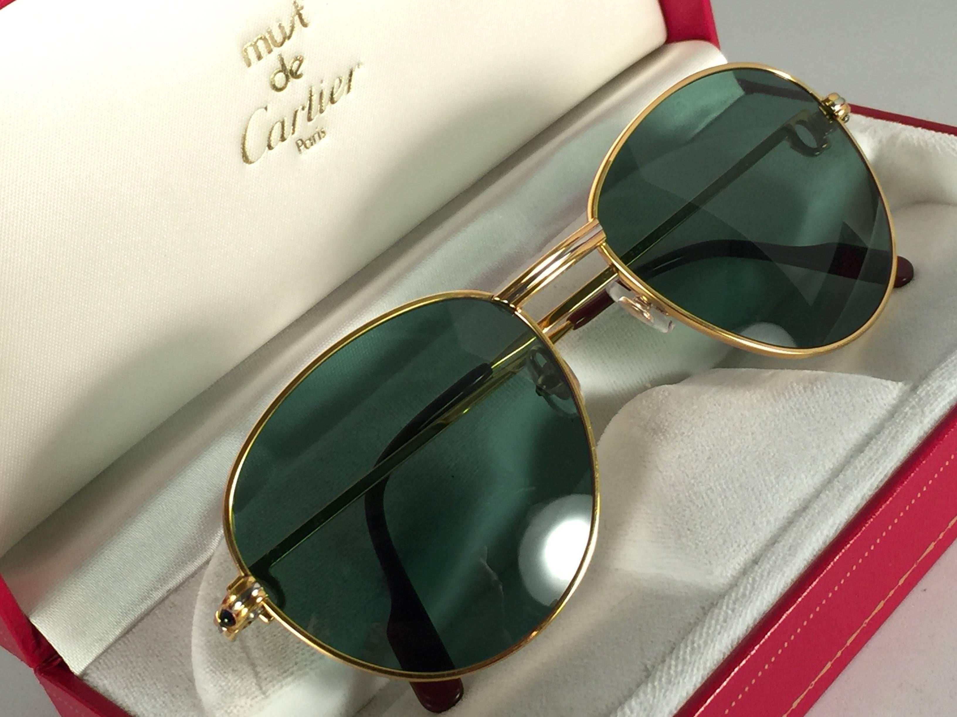 New Cartier Sapphire rounded sunglasses. G15 Grey original Cartier (uv protection) lenses. Frame is with the famous yellow and white gold accents on the front and on both sides. All hallmarks, from 1989. Red enamel with Cartier gold signs on the