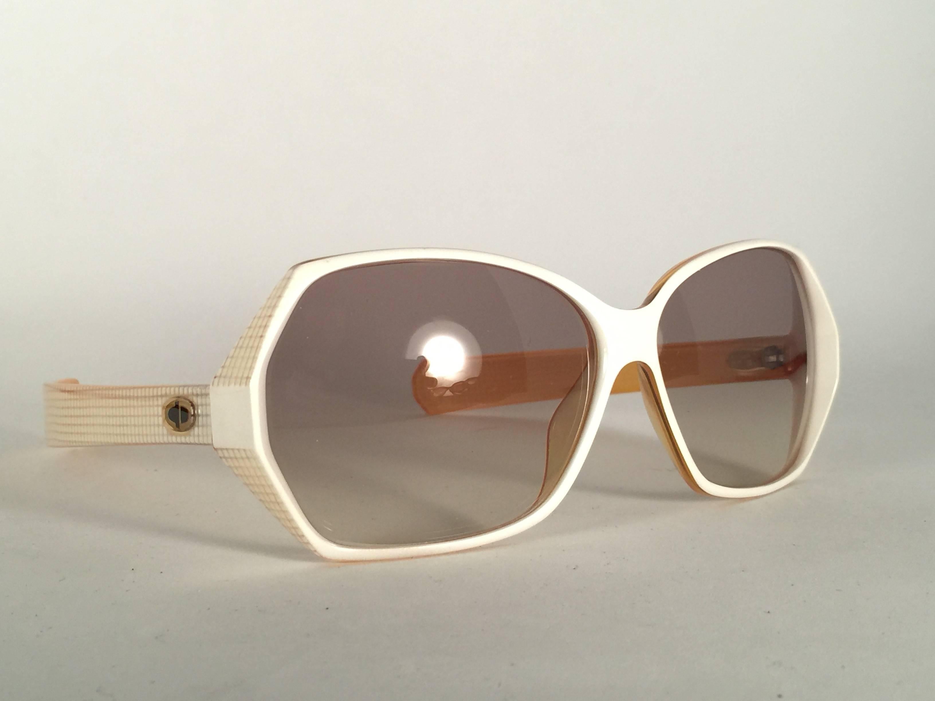 New Vintage Christian Dior 2177 White Origami frame with spotless light brown gradient lenses. 

Made in Germany.
 
Produced and design in 1970's.

A collector’s piece!

New, never worn or displayed. Comes with its original silver Christian Dior