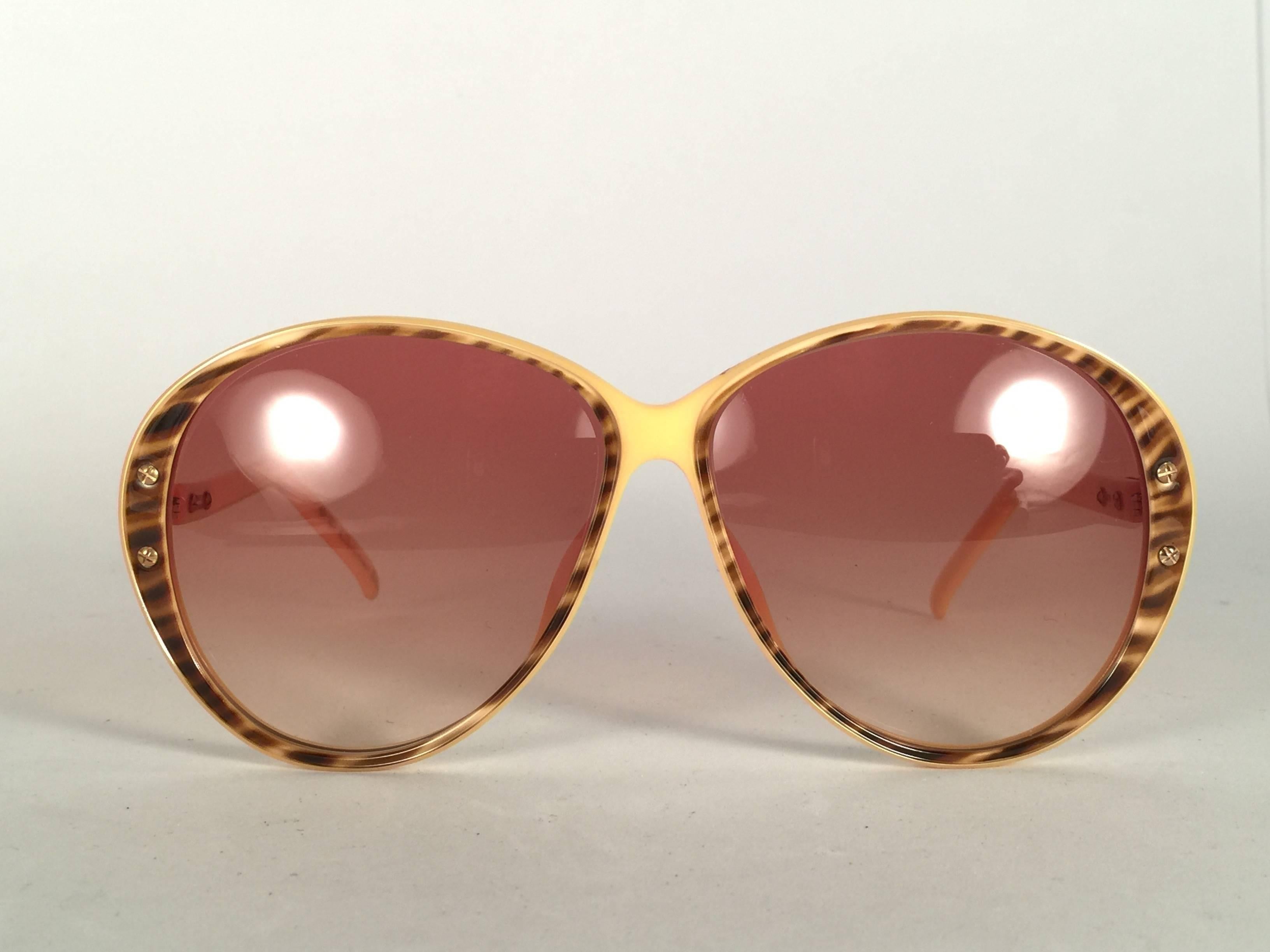 New Vintage Christian Dior 2276 Oversized frame with spotless light  gradient lenses. 

Made in Austria.
 
Produced and design in 1970's.

New, never worn or displayed. Comes with its original silver Christian Dior Lunettes sleeve.
