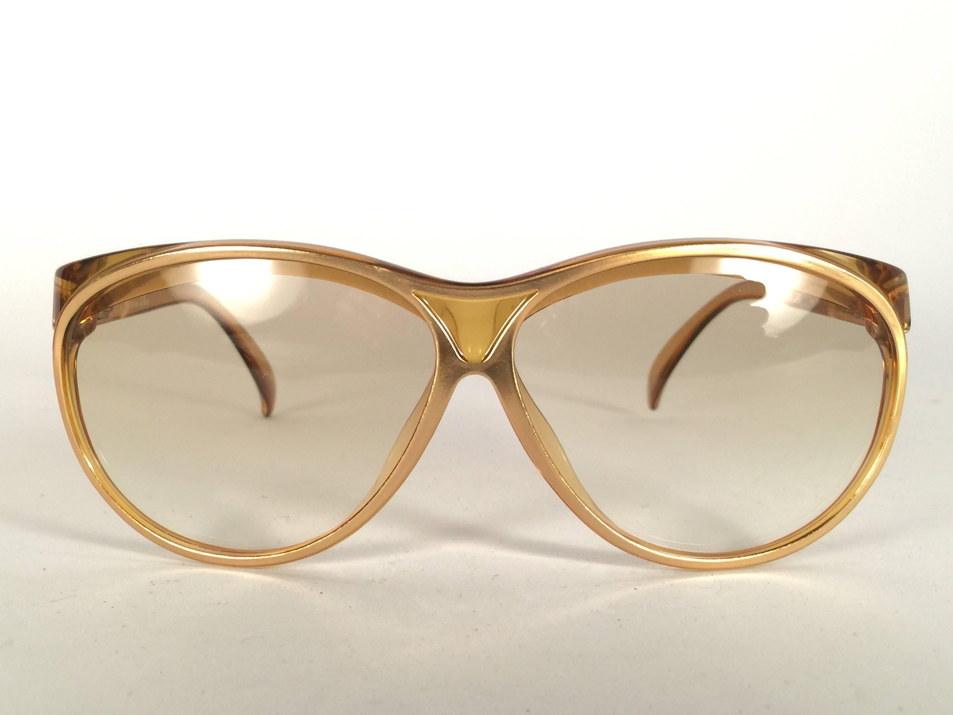 New Vintage Christian Dior 2157 Translucent Oversized frame with spotless light  gradient lenses. 

Made in Austria.
 
Produced and design in 1970's.

New, never worn or displayed. Comes with its original silver Christian Dior Lunettes sleeve.
