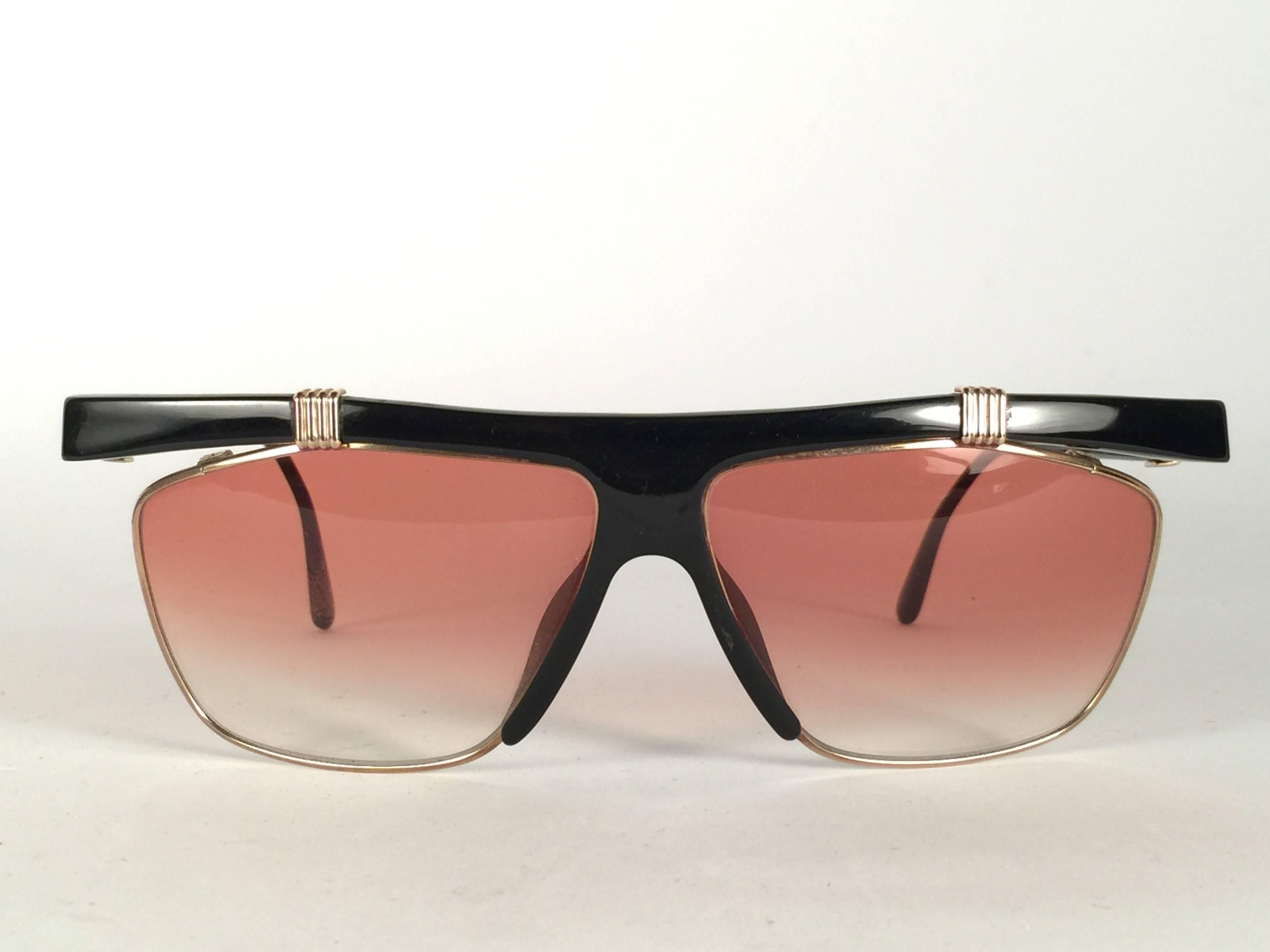 New Vintage Christian Dior 2555 Black frame with spotless light gradient lenses. 

Made in Germany. 

Produced and design in 1970's. Comes with its original silver Christian Dior Lunettes sleeve.