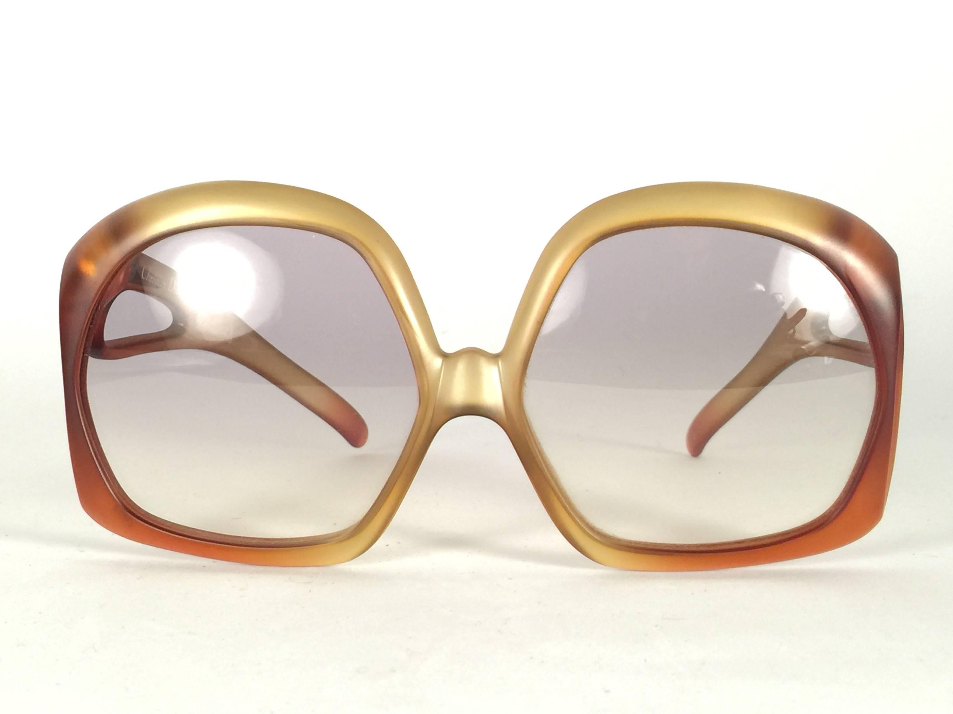 New Vintage Christian Dior 2005 Matte amber ombre frame sporting spotless lenses. 

Made in Germany.
 
Produced and design in 1970's.

New, never worn or displayed. Comes with its original silver Christian Dior Lunettes sleeve.