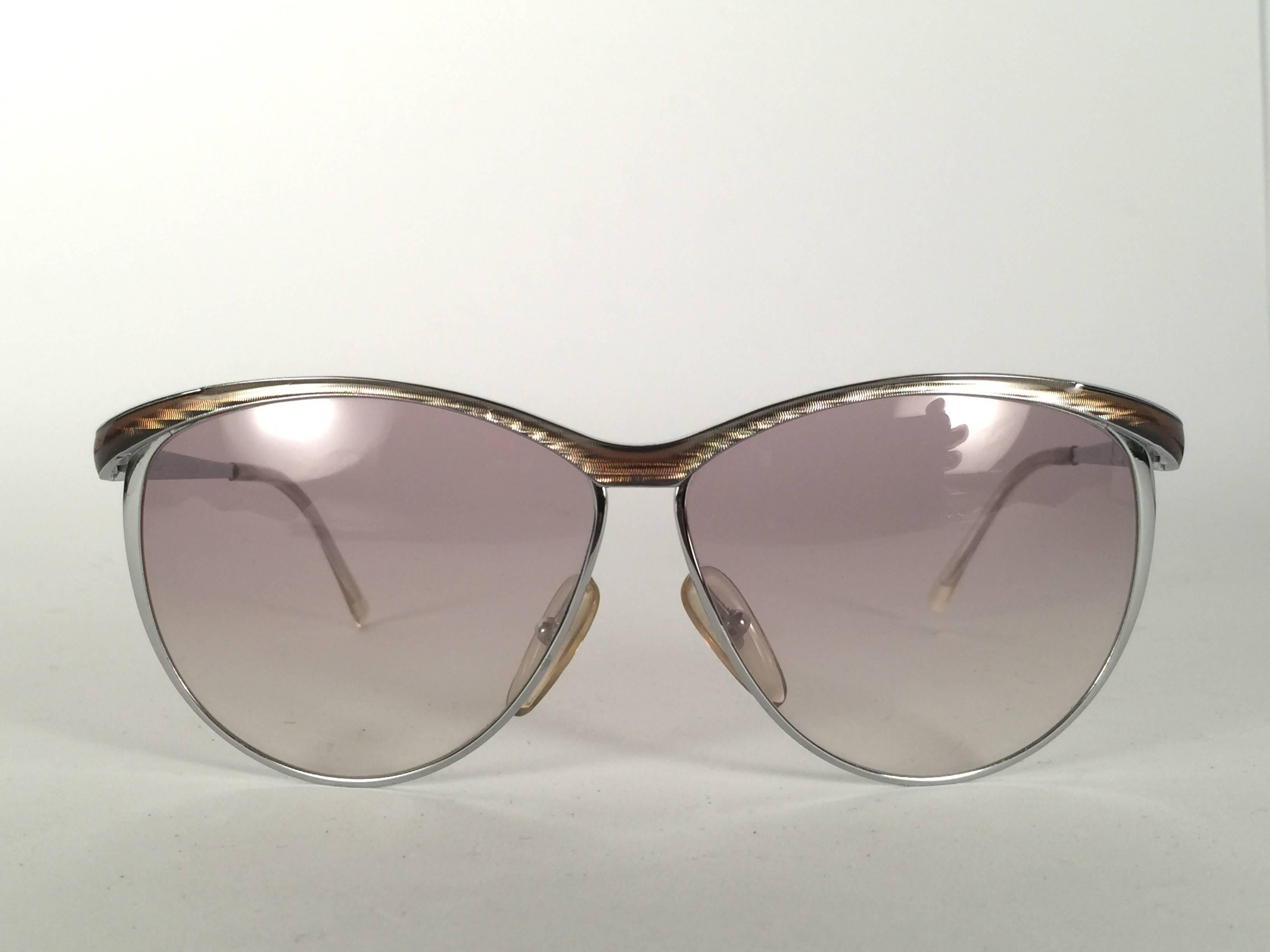 Mint Vintage Christian Dior 2150 Oversized Silver frame with spotless light gradient lenses.   
Made in Germany.  

Produced and design in 1970's.  

Comes with its original silver Christian Dior Lunettes sleeve.