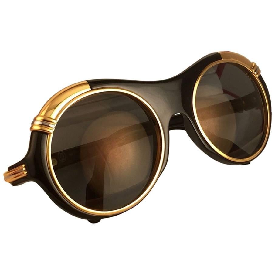New from ,  Original Cartier Diabolo Art Deco Sunglasses with spotless amazing brown gold mirrored (uv protection). 
Frame has the famous real gold and white gold accents in the middle and on the sides.
All hallmarks. Cartier gold signs on the