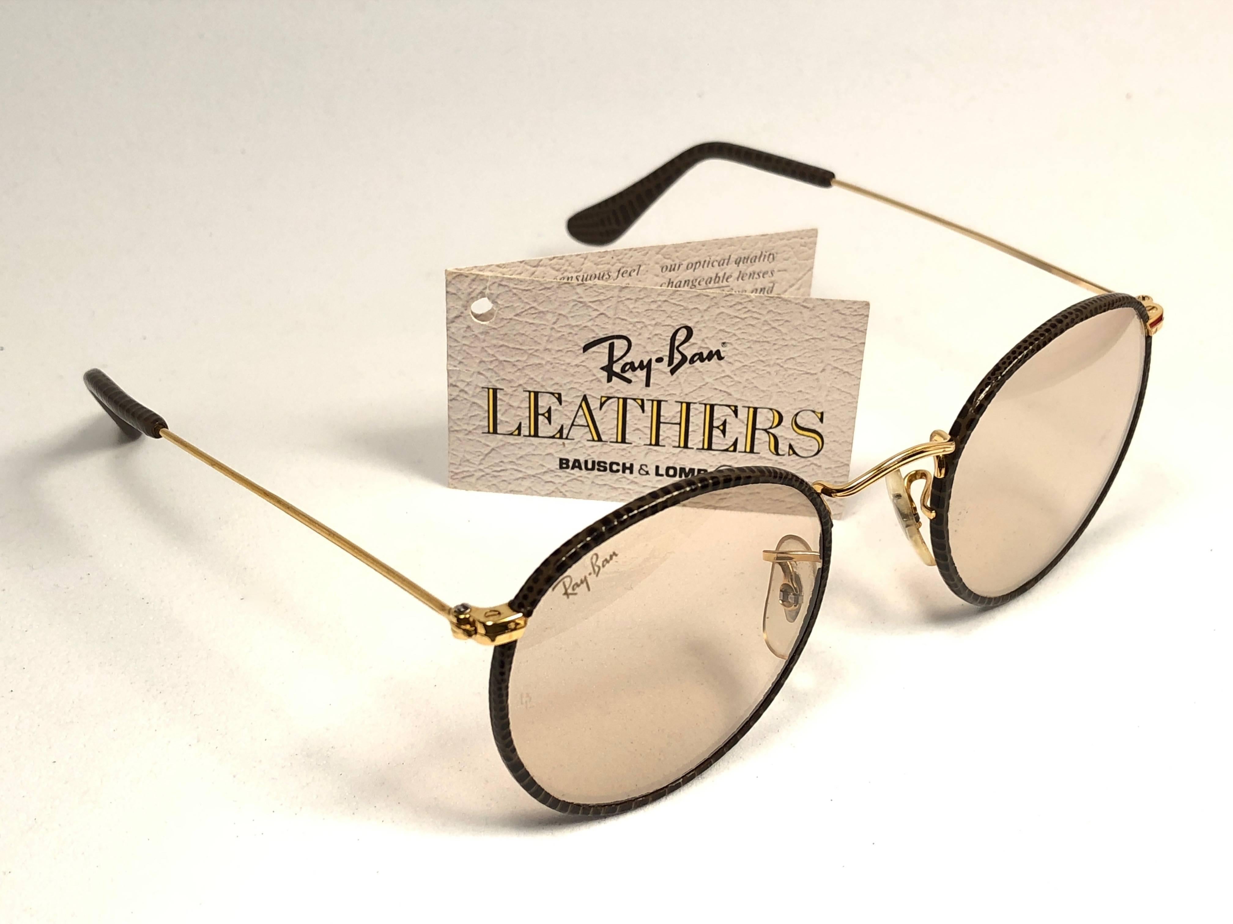 New Vintage Ray Ban black leather with gold metal combination frame sporting light brown lenses.
Comes with its original Ray Ban B&L case. Please notice this item may show minor sign of wear due to storage.  
Rare and hard to find in this new, never