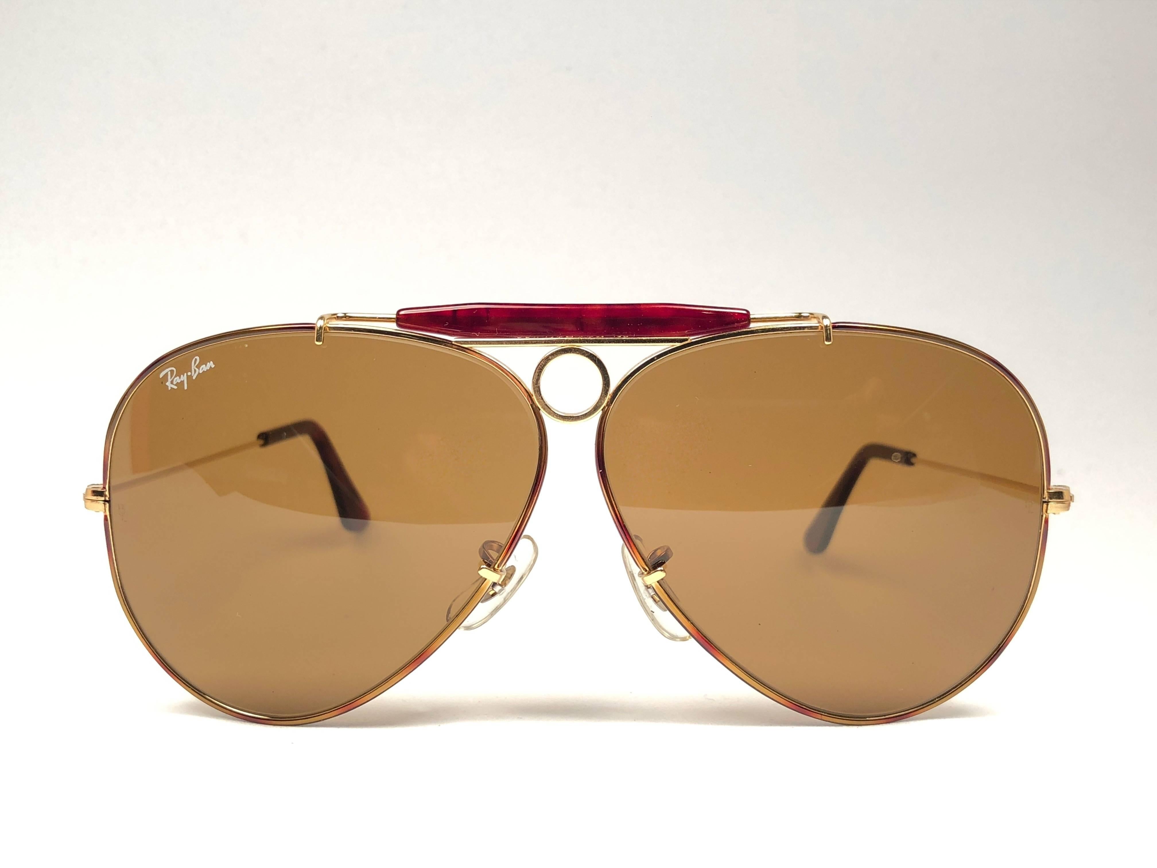 New Vintage Ray Ban Shooter Tortuga coating in 62mm. B&L etched in both B15 lenses.  The time of lenses block 85% of the sunlight.
Comes with its original Ray Ban B&L case. This pair may show minor sign of wear due to nearly 40 years of storage.
A