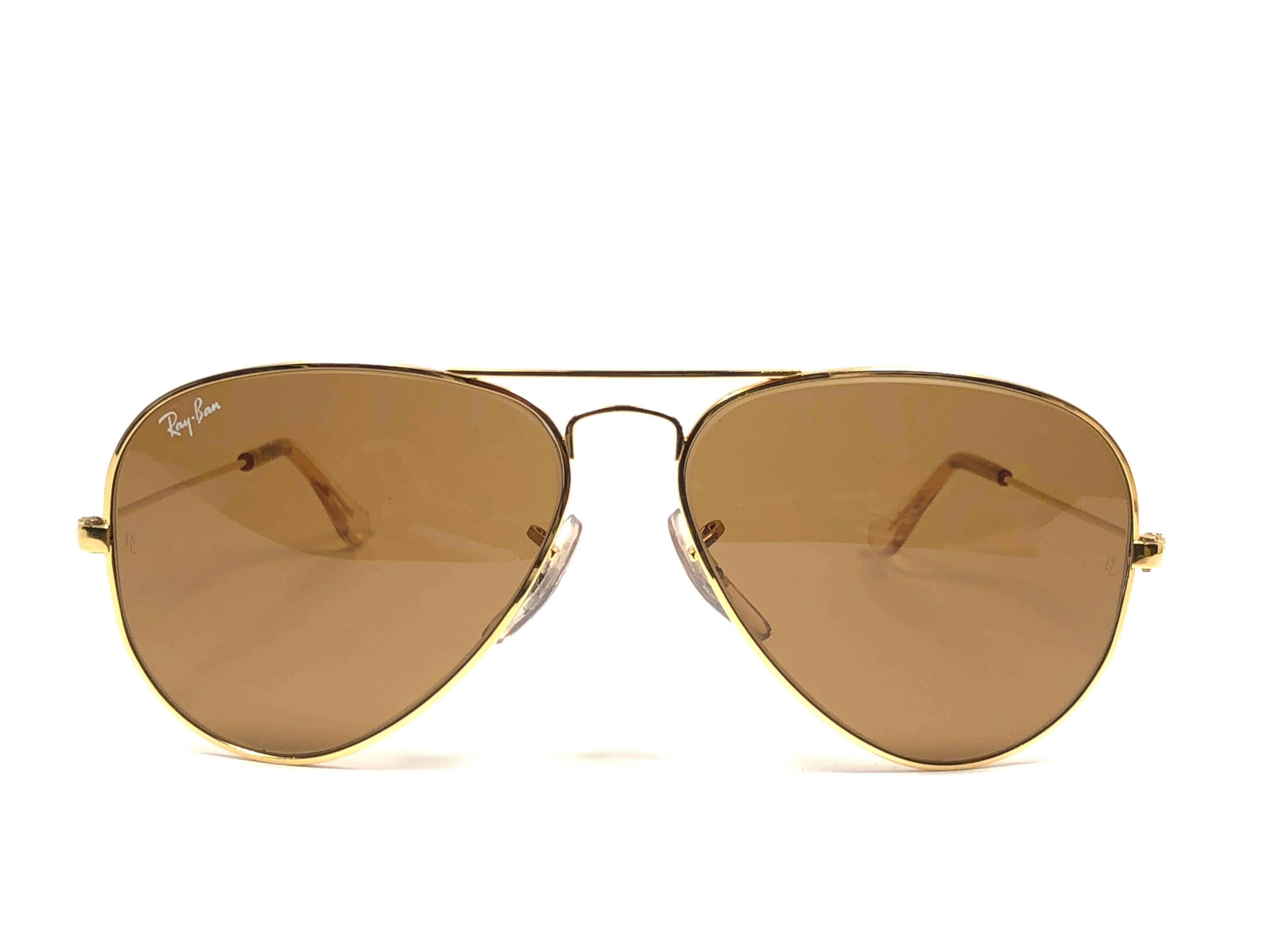 New Super special vintage Ray Ban Aviator Gold frame with B&L B15 Brown Lenses in SIZE 62!! 
Comes with its original Ray Ban B&L case. 
Rare and hard to find in this new, never worn or displayed condition.