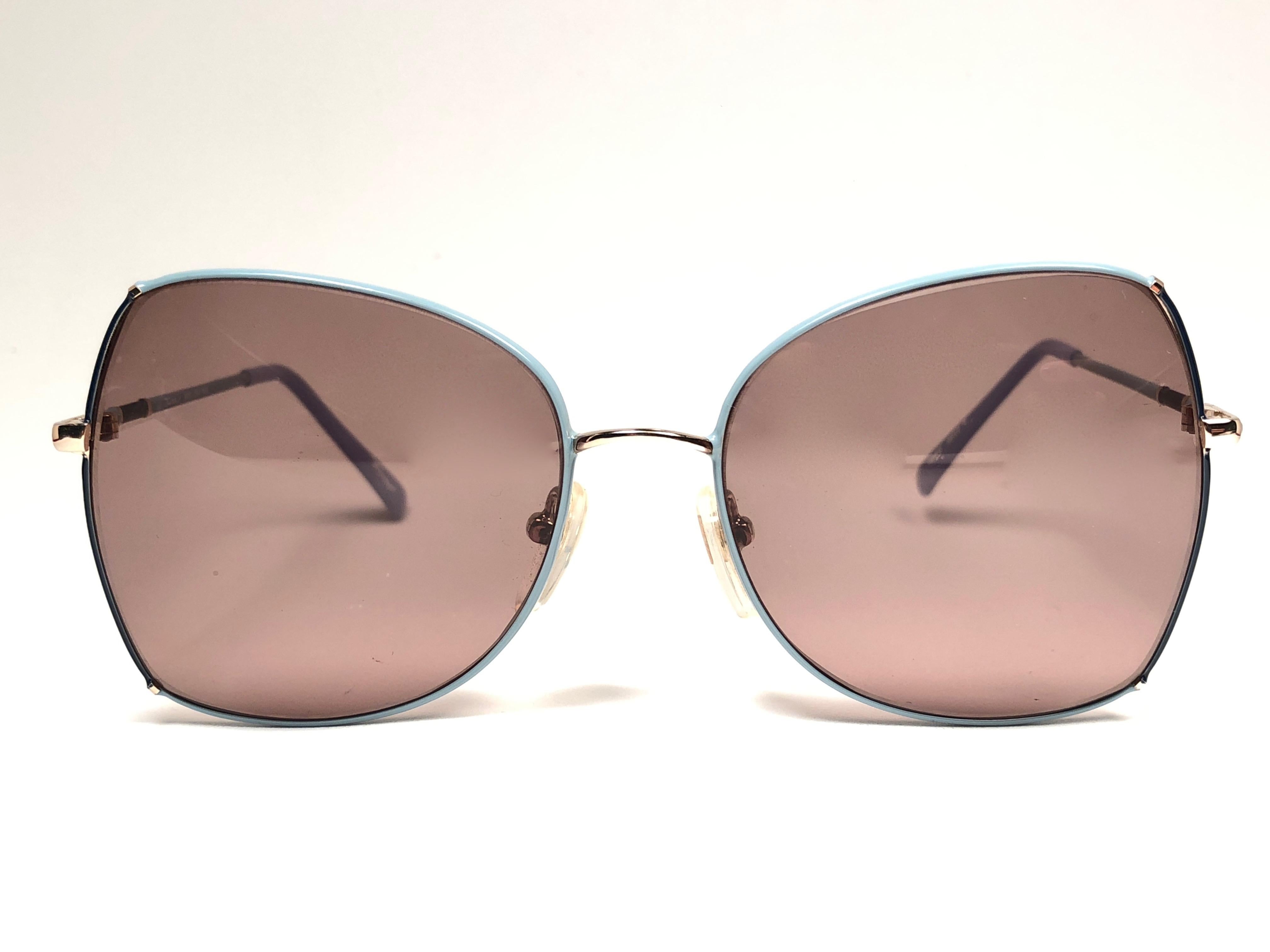 Sunglasses circa 1980's by Tura.  

Please noticed this item its nearly 40 years old and has been on a private collection, therefore the frame show sign of wear according to age and minimum wear. 
Made in France.