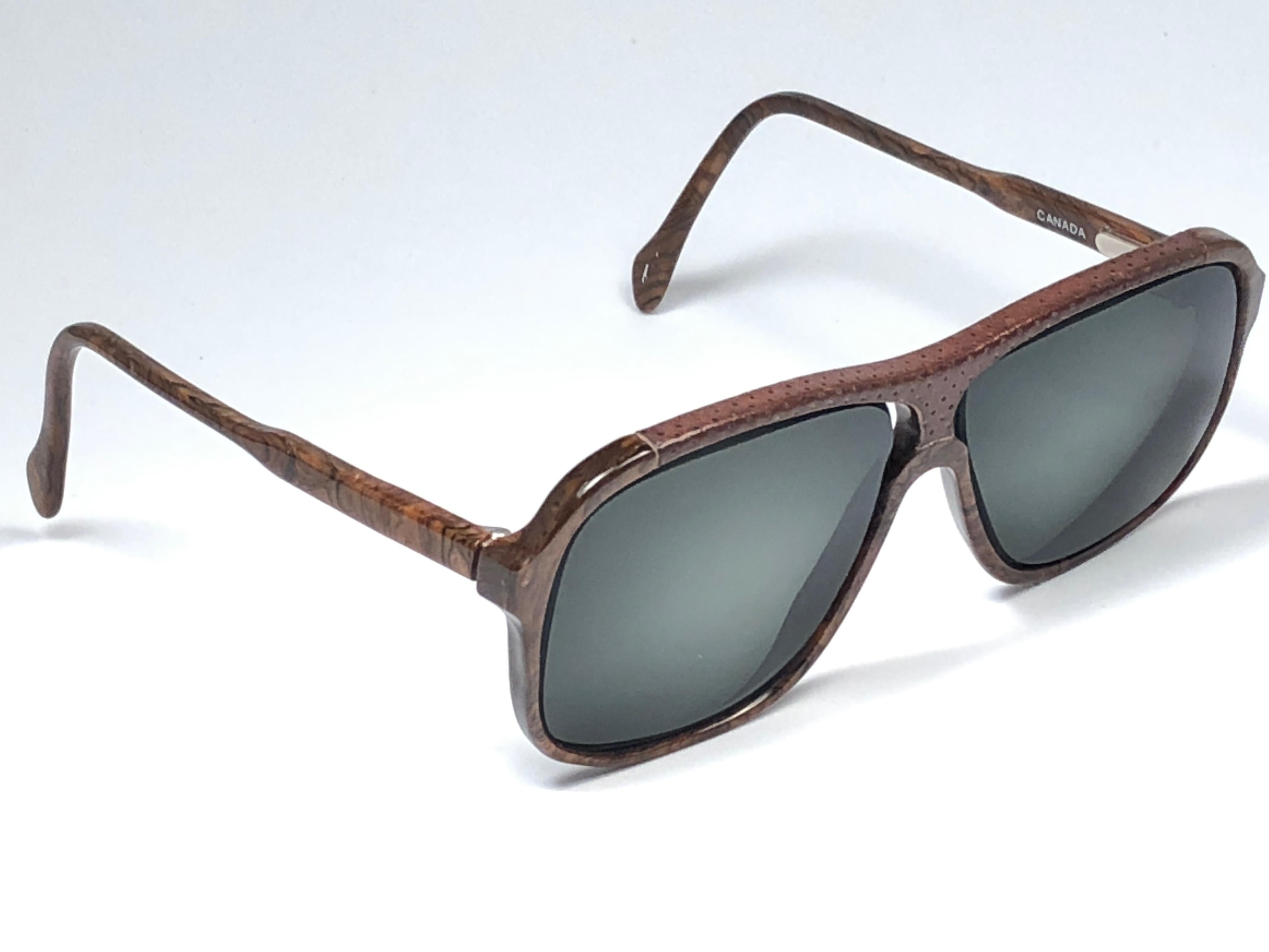 Sunglasses circa 1980's by Tura.  

Please noticed this item its nearly 40 years old and has been on a private collection, therefore the frame show sign of wear according to age and minimum wear. 
Made in France.