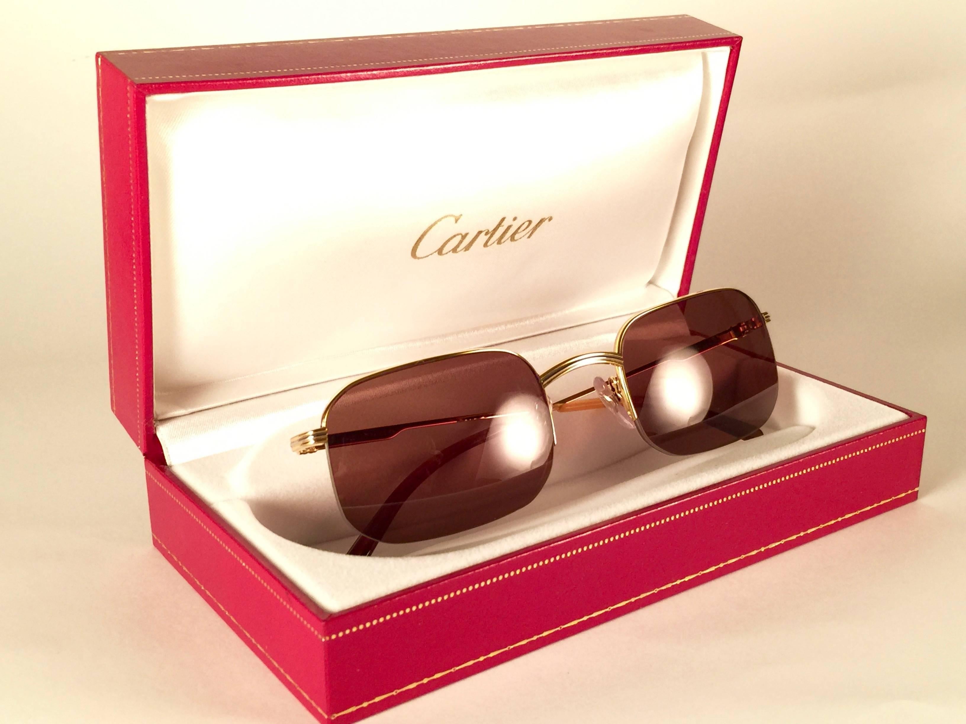 New 1990 Cartier Broadway half frame Vendome 49 22 Sunglasses with brown (uv protection) lenses. All hallmarks. Cartier gold signs on the ear paddles. These are like a pair of jewels on your nose. Please notice that this sunglasses are nearly 30