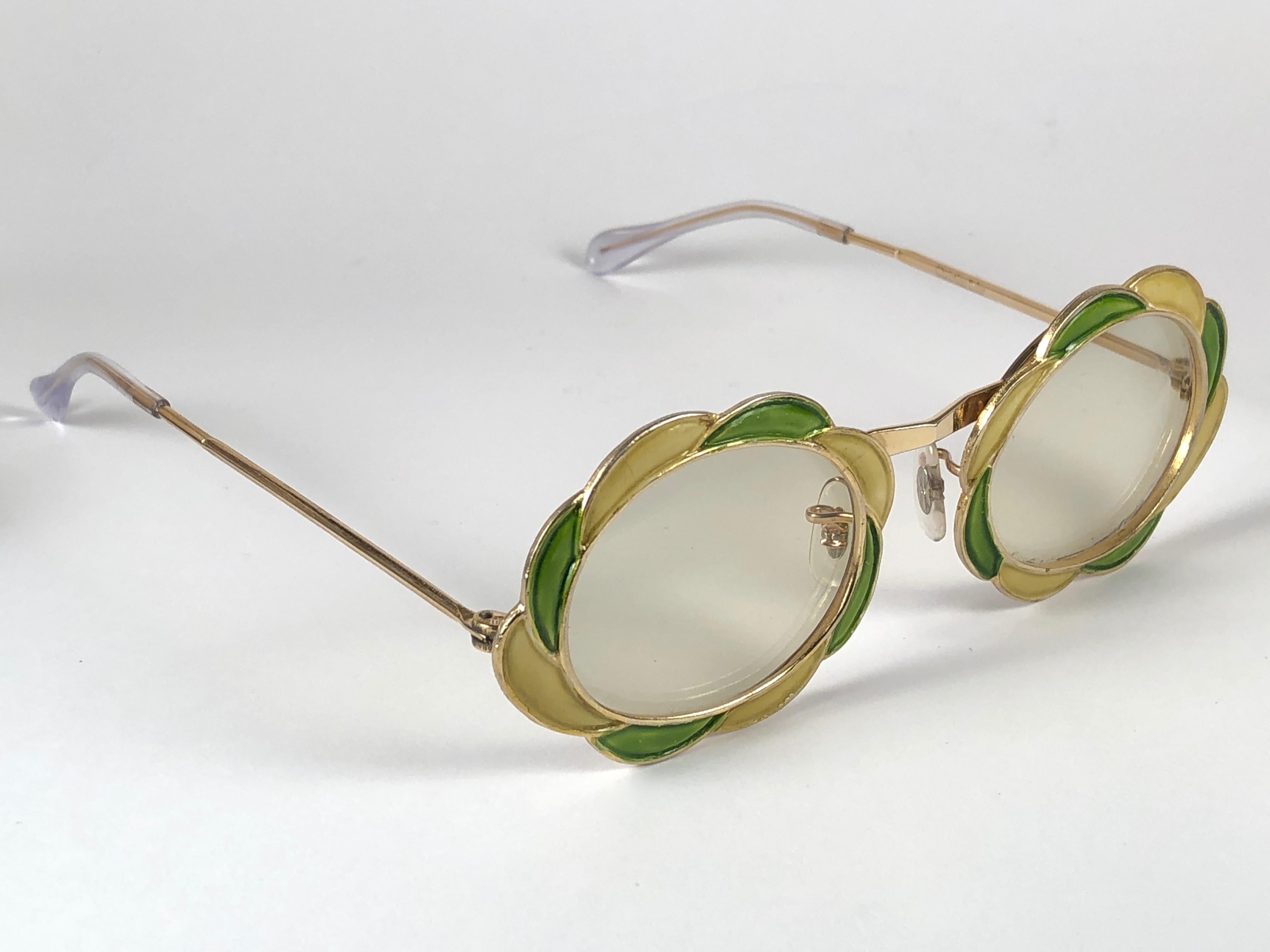 Ultra rare pair of Christian Dior Sunglasses circa 1960's.

This is a seldom and rare piece not only for its aesthetic value but for its importance in the sunglasses and fashion history.   
Delicate enamel o cast iron frame emulating a delicate