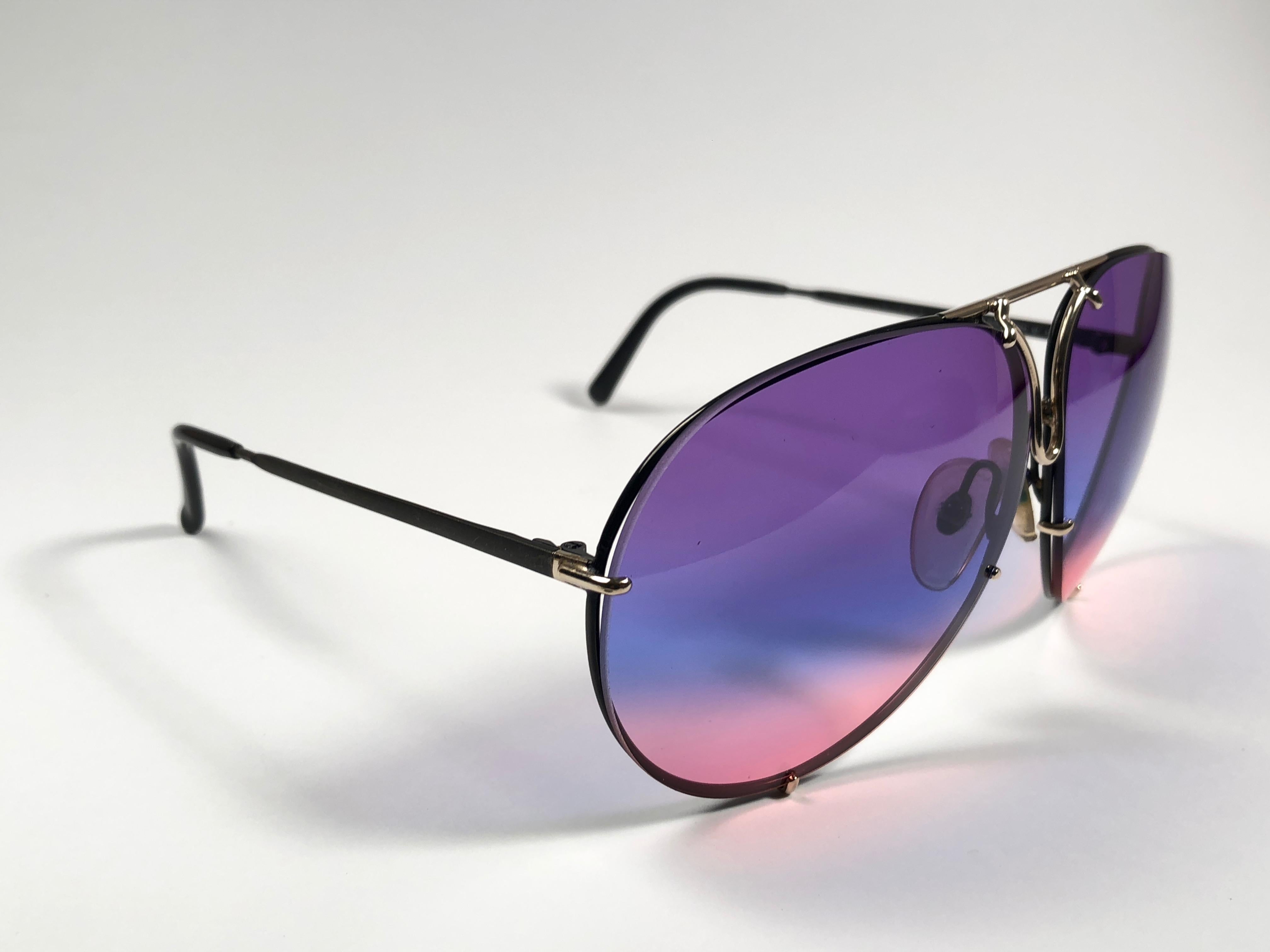 New 1980's Porsche Design 5623 frame with rainbow lenses.  Amazing craftsmanship and quality.  
Comes with the original black Porsche hard case thats has some wear on it due to nearly 40 years of storage. 
New, never worn. This item may show minor