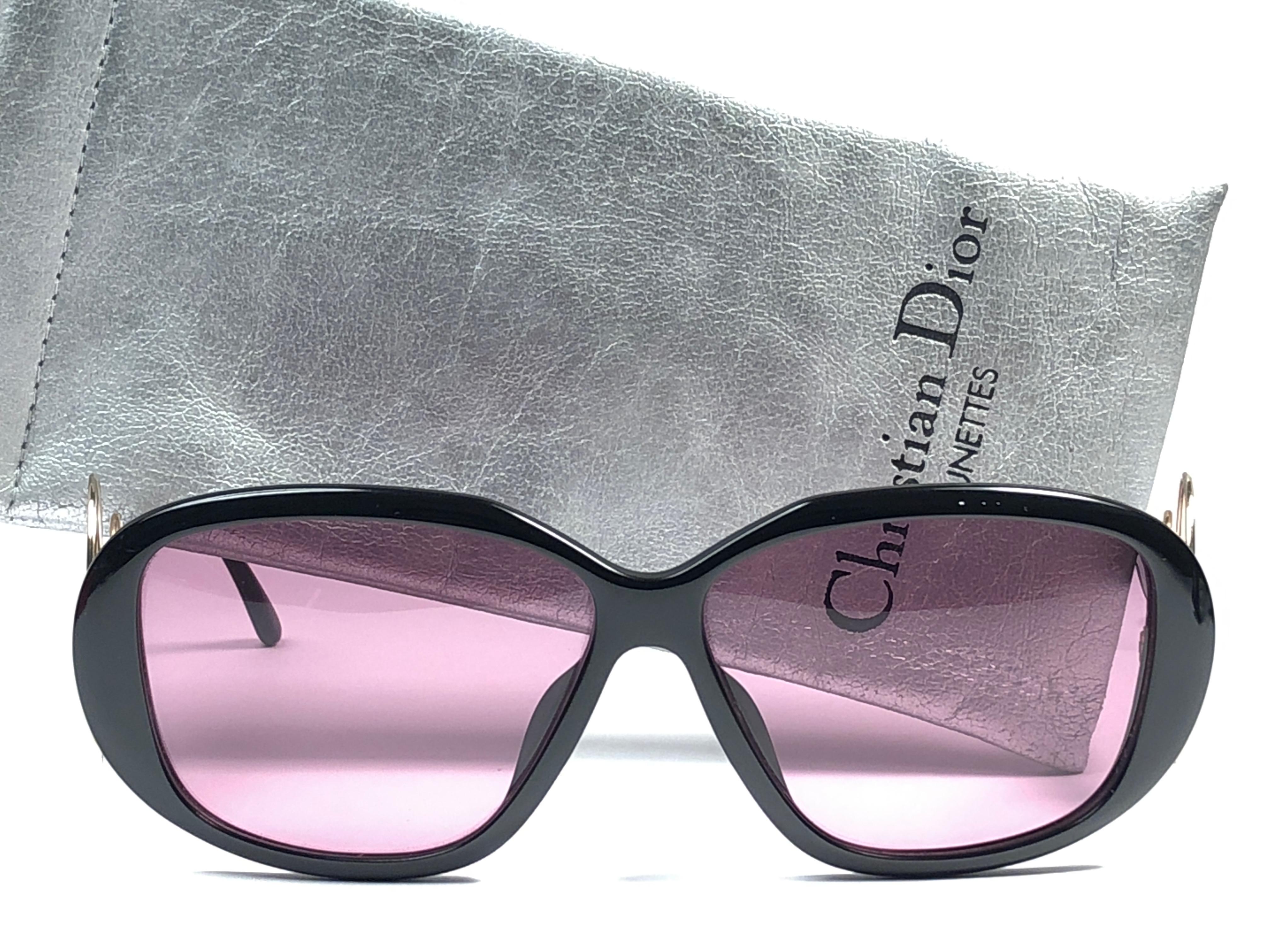 New Vintage Christian Dior 2558 90 black frame, gold circle accents with spotless light rose lenses. 

Made in Germany.
 
Produced and design in 1970's.

New, never worn or displayed. This item may show minor sign of wear due to storage. Comes with