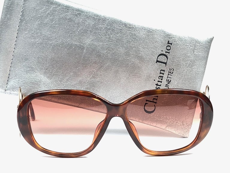 New Vintage Christian Dior 2558 10 tortoise frame, gold circle accents with spotless light brown gradient lenses. 

Made in Germany.
 
Produced and design in 1970's.

New, never worn or displayed. This item may show minor sign of wear due to