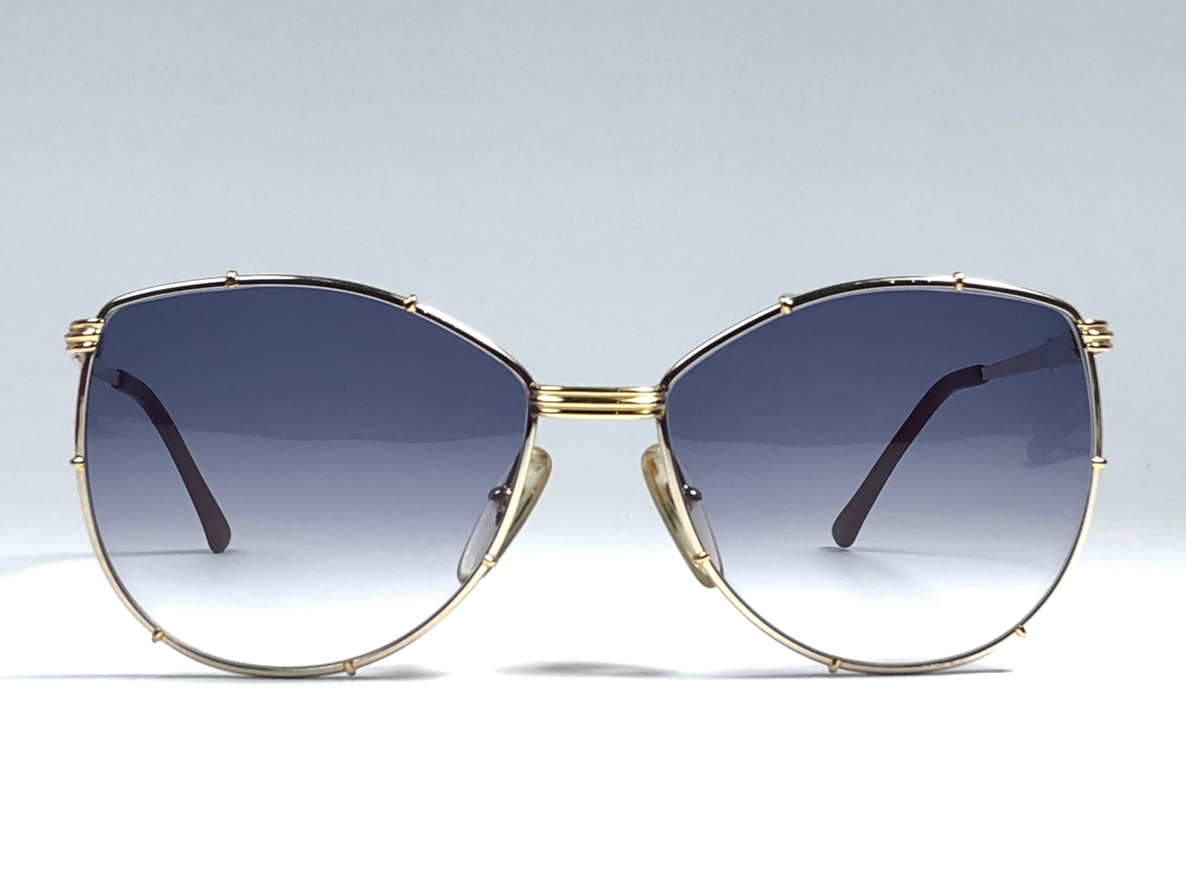 New Vintage Christian Dior 2472 silver frame with gold accented. Blue gradient lenses. 

Made in Germany.

Produced and design in 1970's.

New, never worn or displayed. This item may show minor sign of wear due to storage. Comes with its original