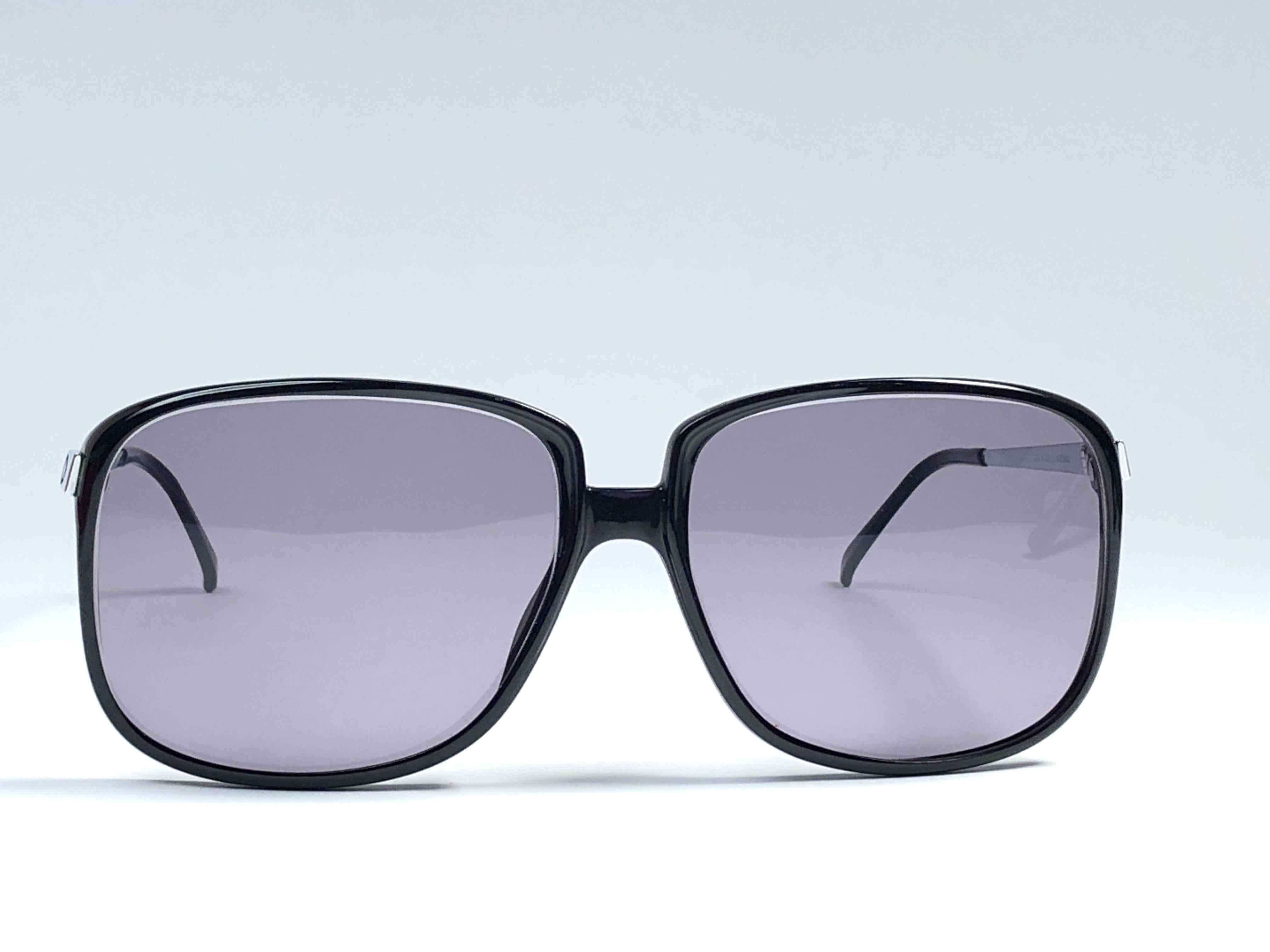 New vintage Christian Dior Monsieur black oversized sunglasses. .

Spotless medium grey lenses.

Comes with it original CD Monsieur sleeve.

New, never worn or displayed this item may show light sign of wear due to storage.

Made in Austria
