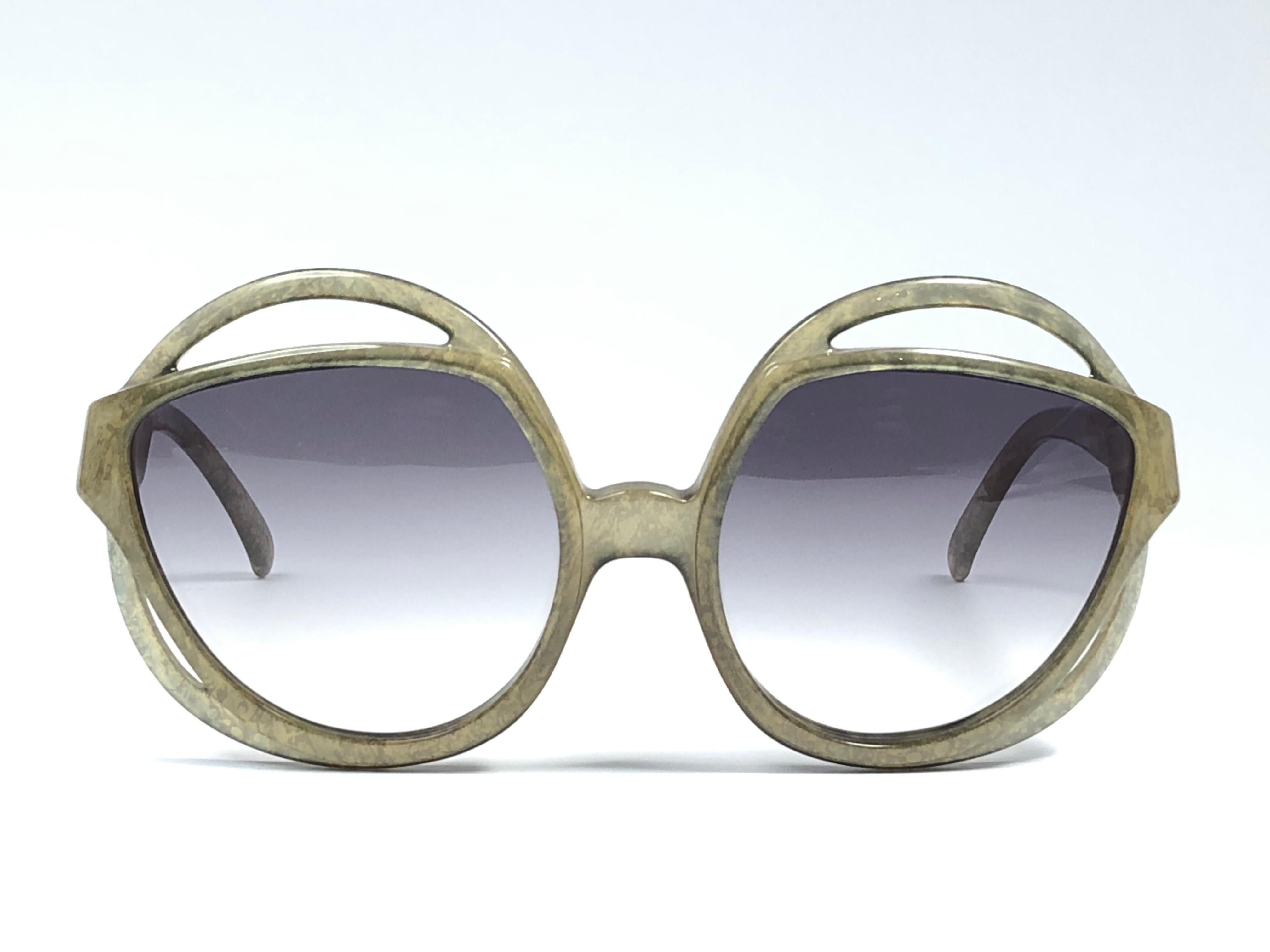 New Vintage Christian Dior 2027 60 Green Jasped frame sporting light gradient lenses. 

Made in Germany.
 
Produced and design in 1970's.

A collector’s piece!

New, never worn or displayed. Comes with its original silver Christian Dior Lunettes