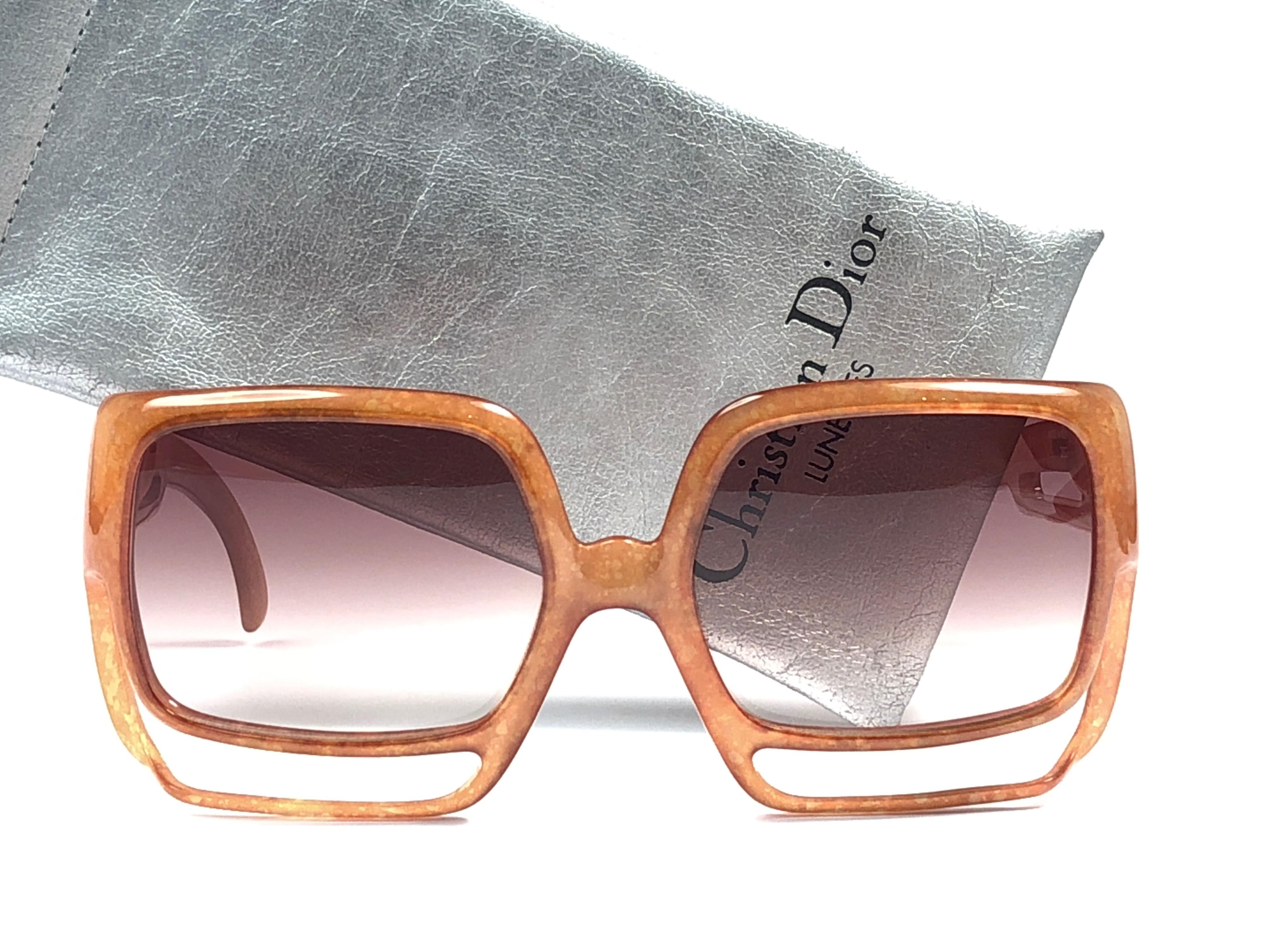 New Vintage Christian Dior 2029 30 Medium amber jasped frame sporting light gradient lenses. 

Made in Germany.
 
Produced and design in 1970's.

A collector’s piece!

New, never worn or displayed. Comes with its original silver Christian Dior