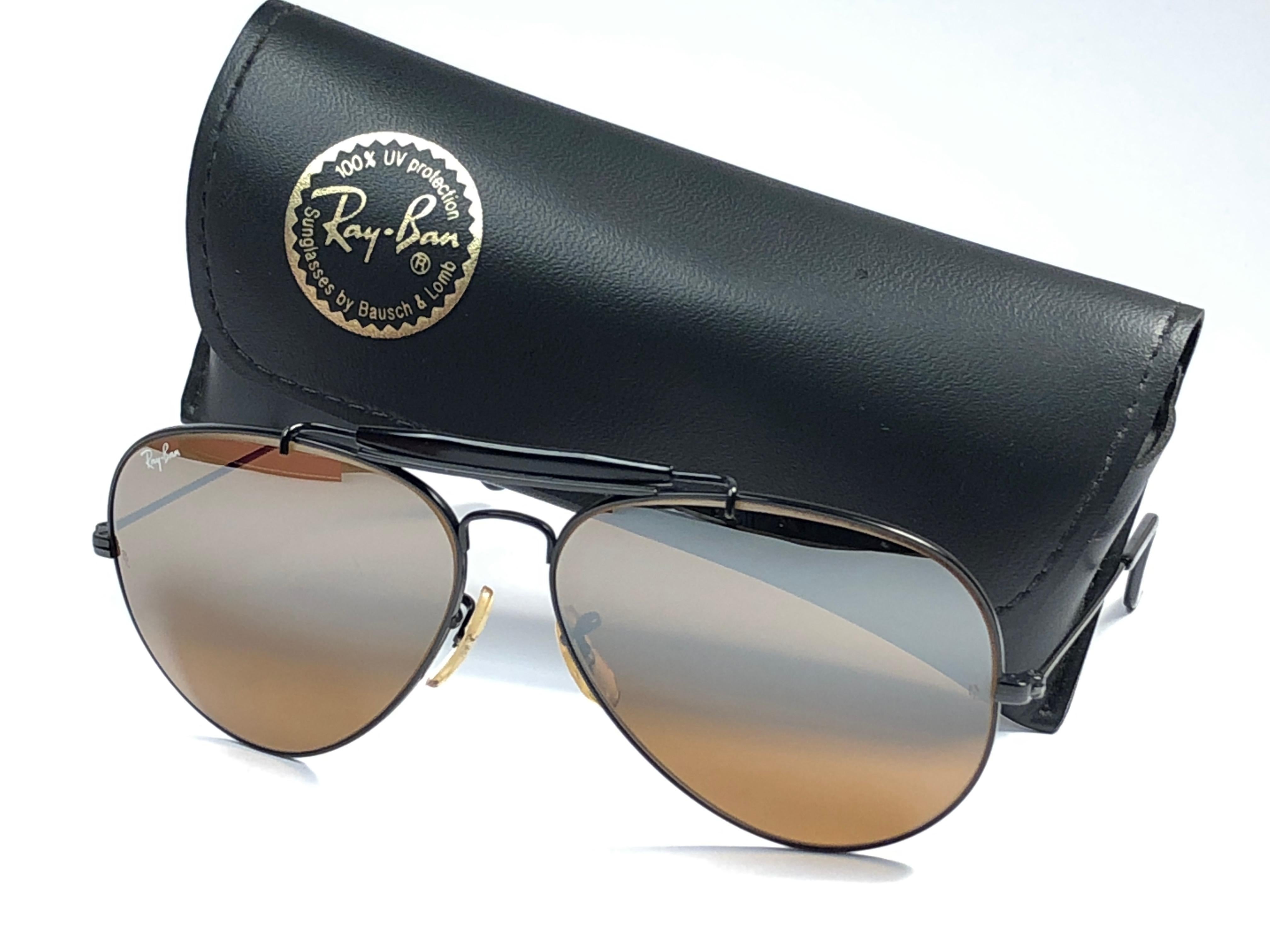 Mint Vintage Ray Ban Outdoorsman 62mm with B15 top mirror gradient lenses. B&L etched  in both lenses. Comes with its original Ray Ban B&L case. 

This pair may have minor sign of wear on frame and lenses due to nearly 40 years of storage. 
