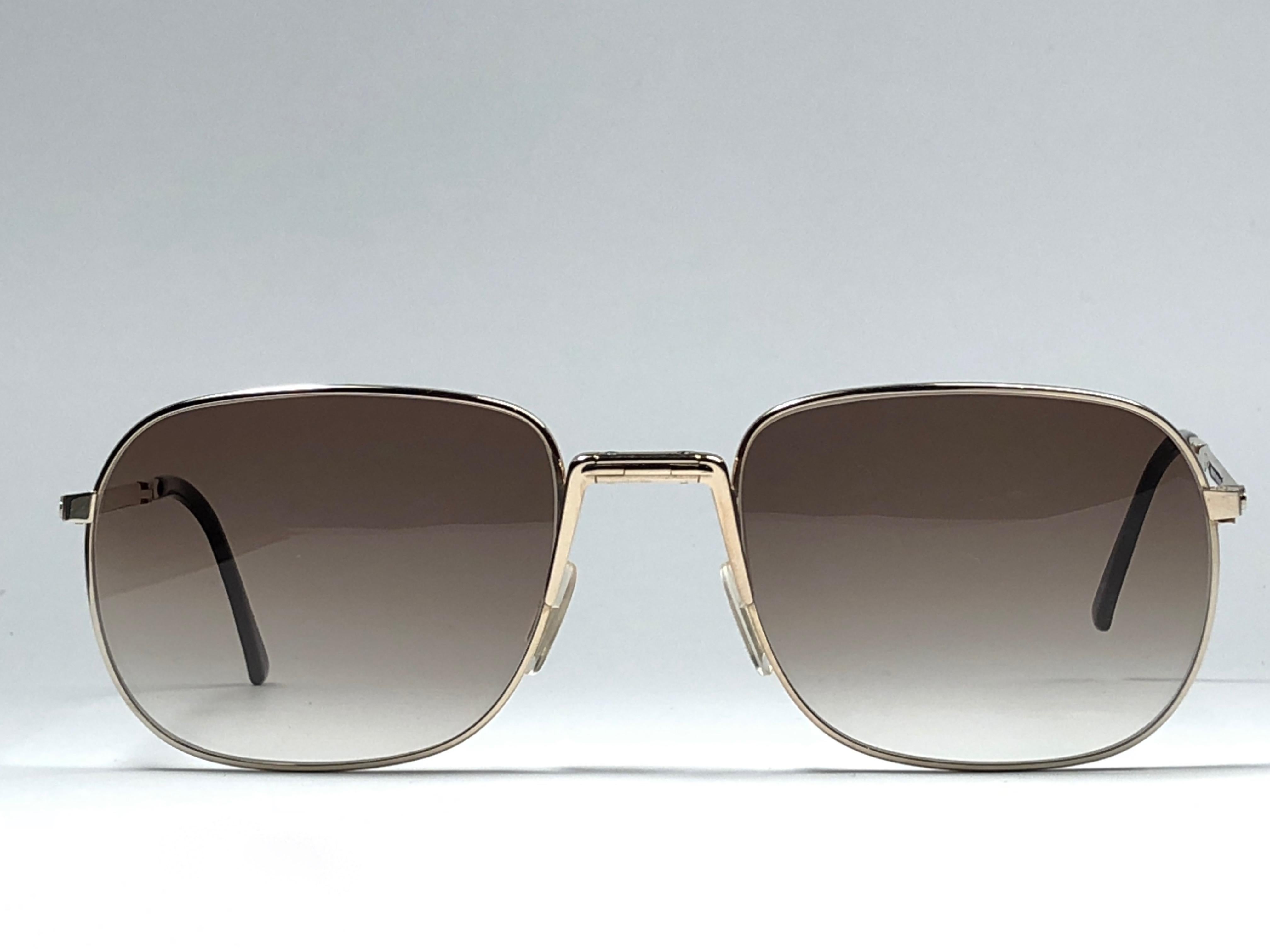 New vintage Christian Dior Monsieur folding sunglasses. .

Spotless brown gradient lenses.

Comes with it original CD Monsieur sleeve.

New, never worn or displayed this item may show light sign of wear due to storage.

Made in Austria