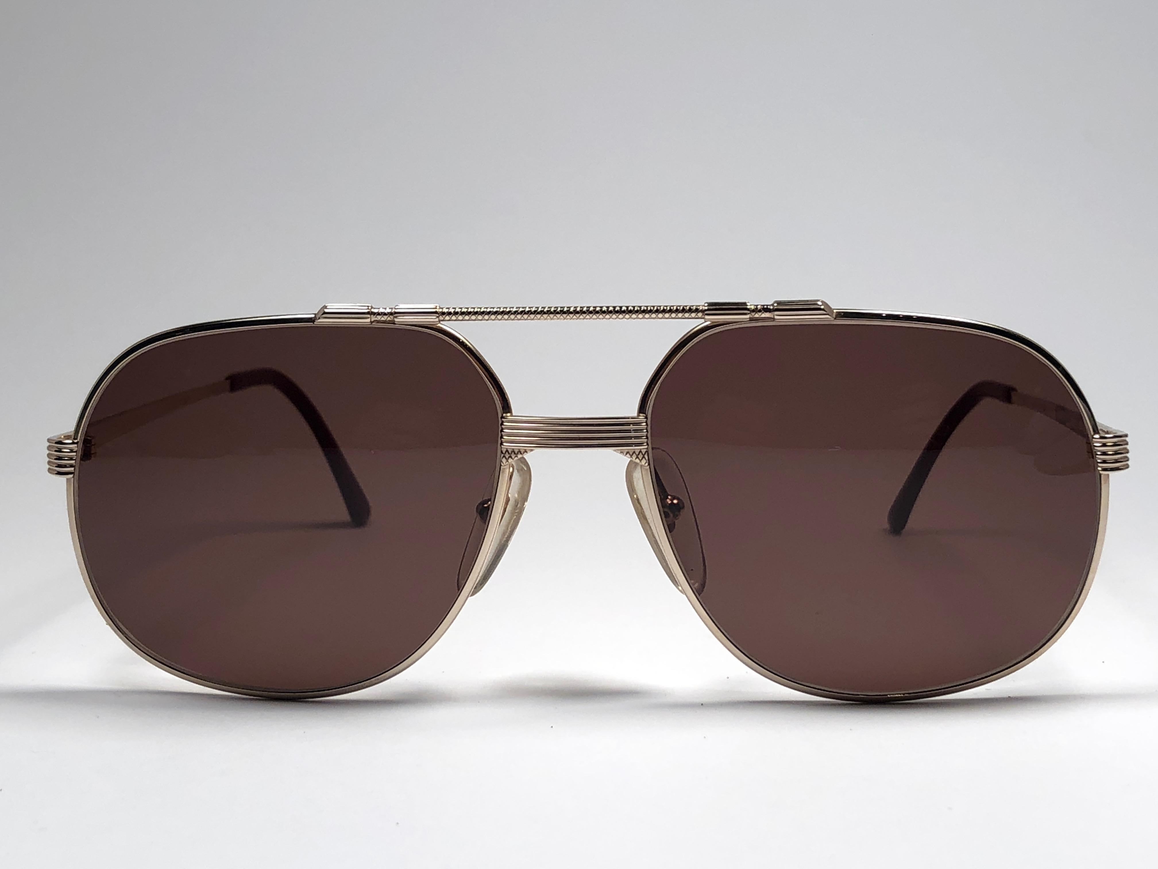 New vintage Christian Dior Monsieur Silver sunglasses. .

Spotless brown solid lenses.

Comes with it original CD Monsieur sleeve.

New, never worn or displayed this item may show light sign of wear due to storage.

Made in Austria