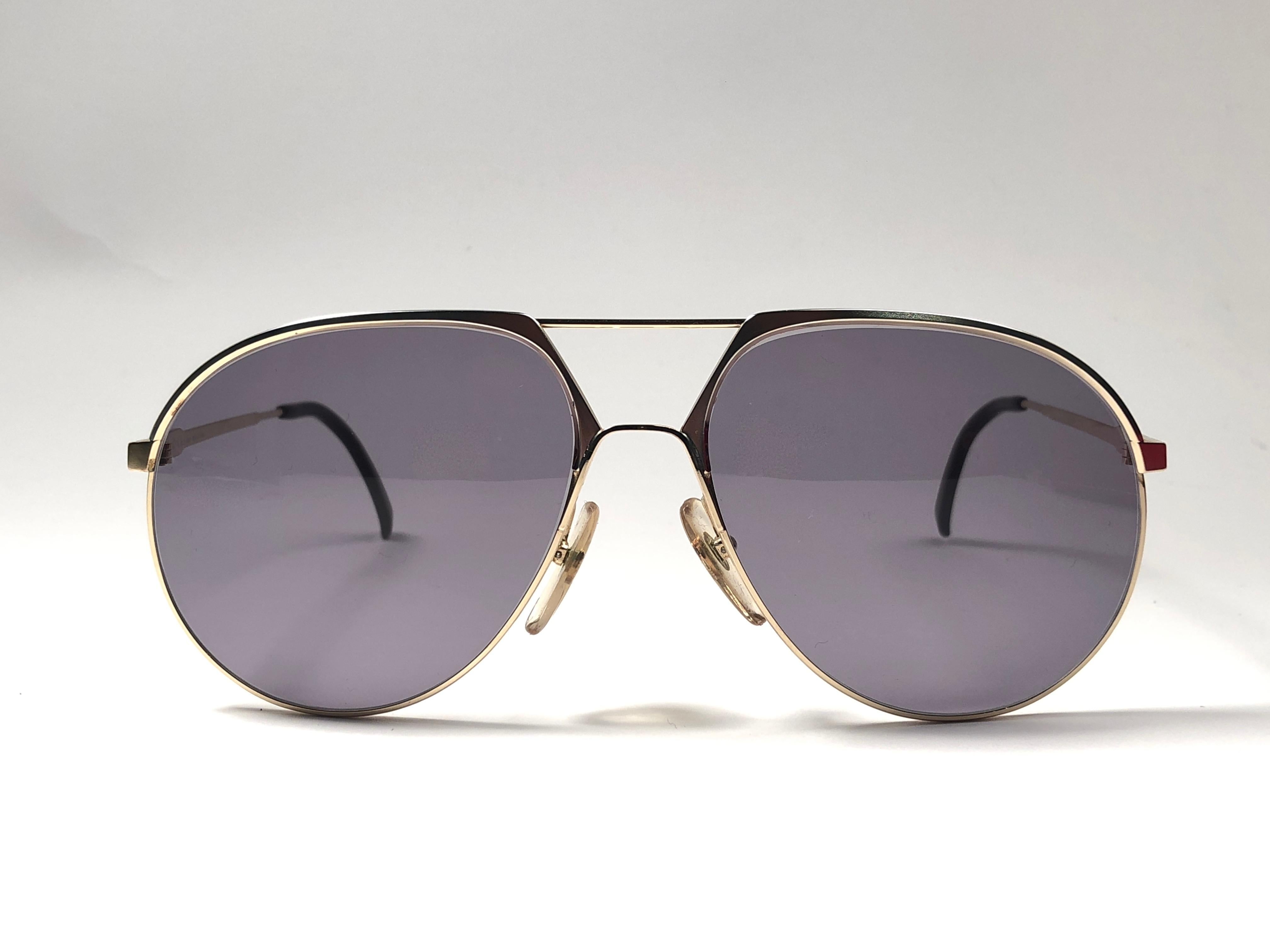 New vintage Christian Dior Monsieur gold sunglasses. .

Spotless grey lenses.

Comes with it original CD Monsieur sleeve.

New, never worn or displayed this item may show light sign of wear due to storage.

Made in Austria