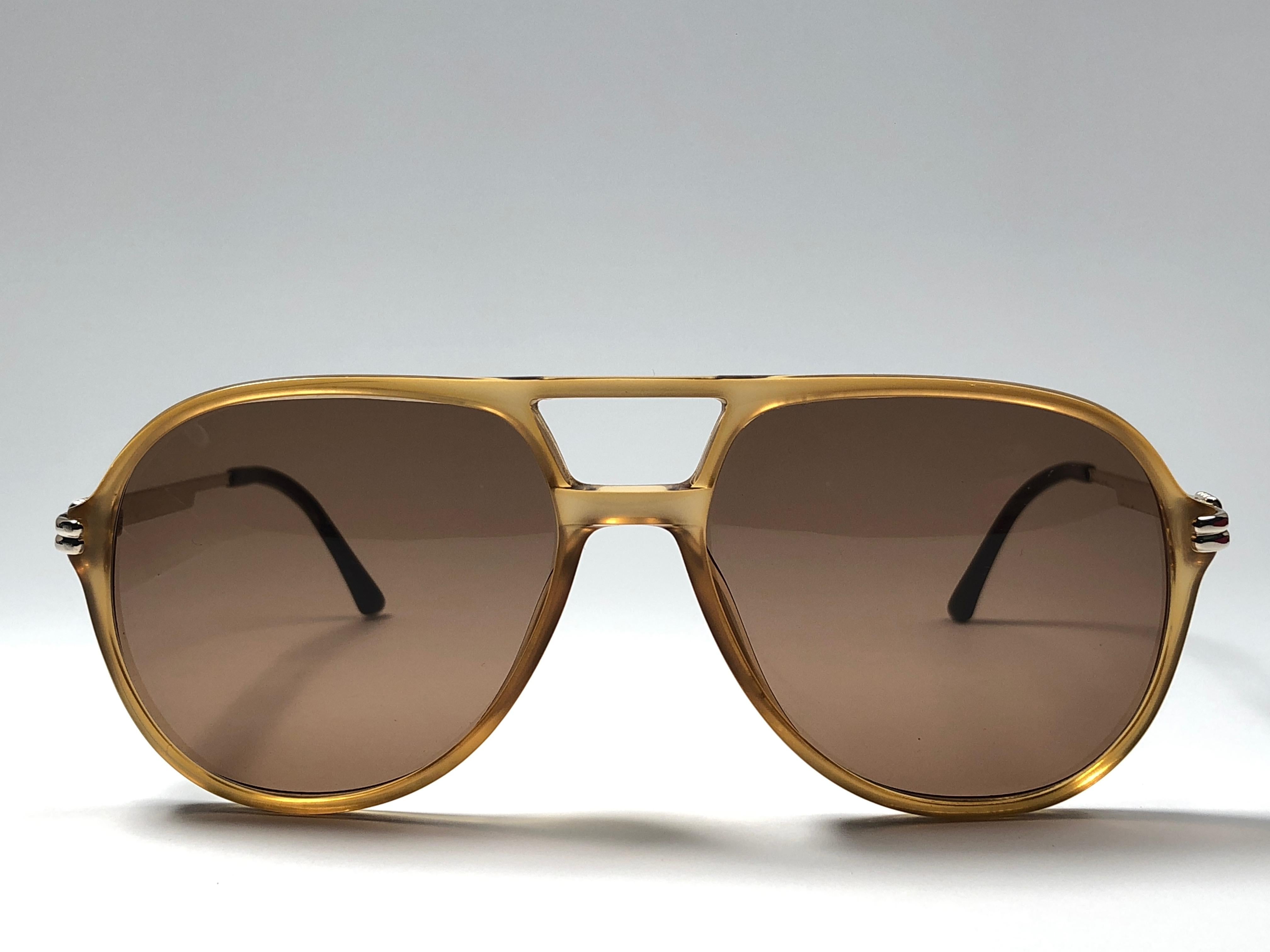 New vintage Christian Dior Monsieur amber translucent details frame.

Spotless brown medium lenses.

Comes with it original CD Monsieur sleeve.

New, never worn or displayed this item may show light sign of wear due to storage.

Made in Austria