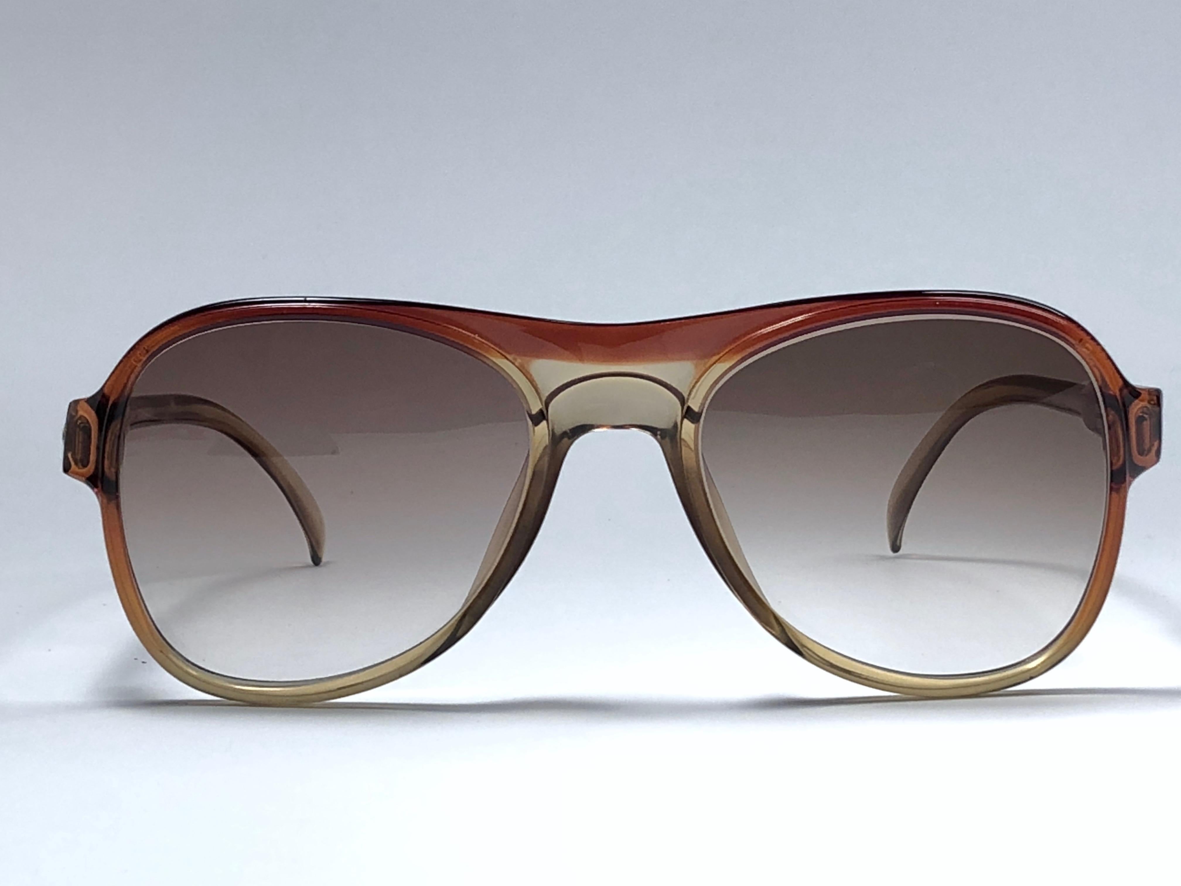 New vintage Christian Dior Monsieur amber translucent details frame.

Spotless brown gradient lenses.

Comes with it original CD Monsieur sleeve.

New, never worn or displayed this item may show light sign of wear due to storage.

Made in Austria