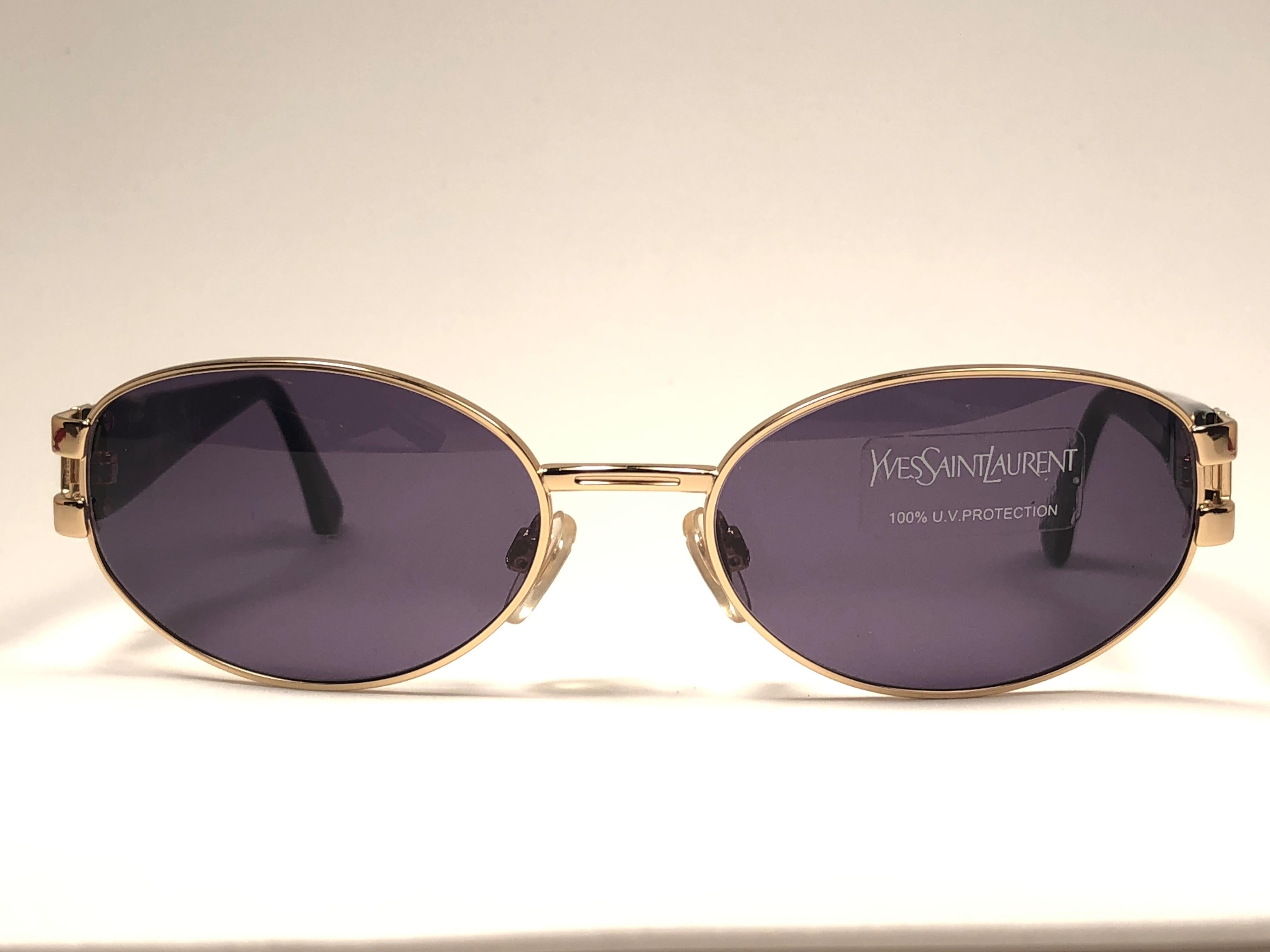 Super cool vintage Yves Saint Laurent 1980’s sunglasses. Oval gold shape framing a pair of solid brown lenses.


This pair is an style statement. The piece could show minor sign of wear due to storage.

A great opportunity to achieve a unique and