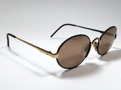 Gianfranco Ferre - Lunettes de soleil vintage noires et dorées ovales, fabriquées en Italie, années 1990, état neuf