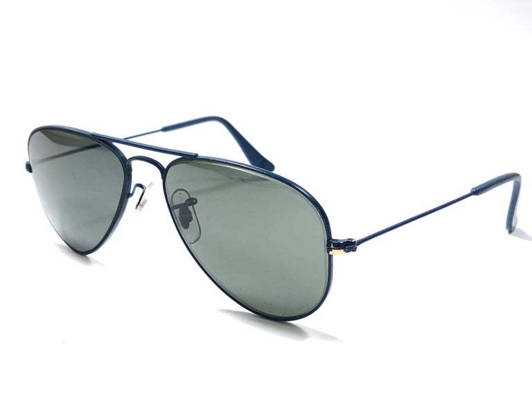 New Super special vintage Ray Ban Aviator blue cobalt frame with B&L G15 Grey Lenses in SIZE 52!! 
The smallest size available, suitable for children.  

Rare and hard to find. Please notice this item has a small piece of the coating missing, please