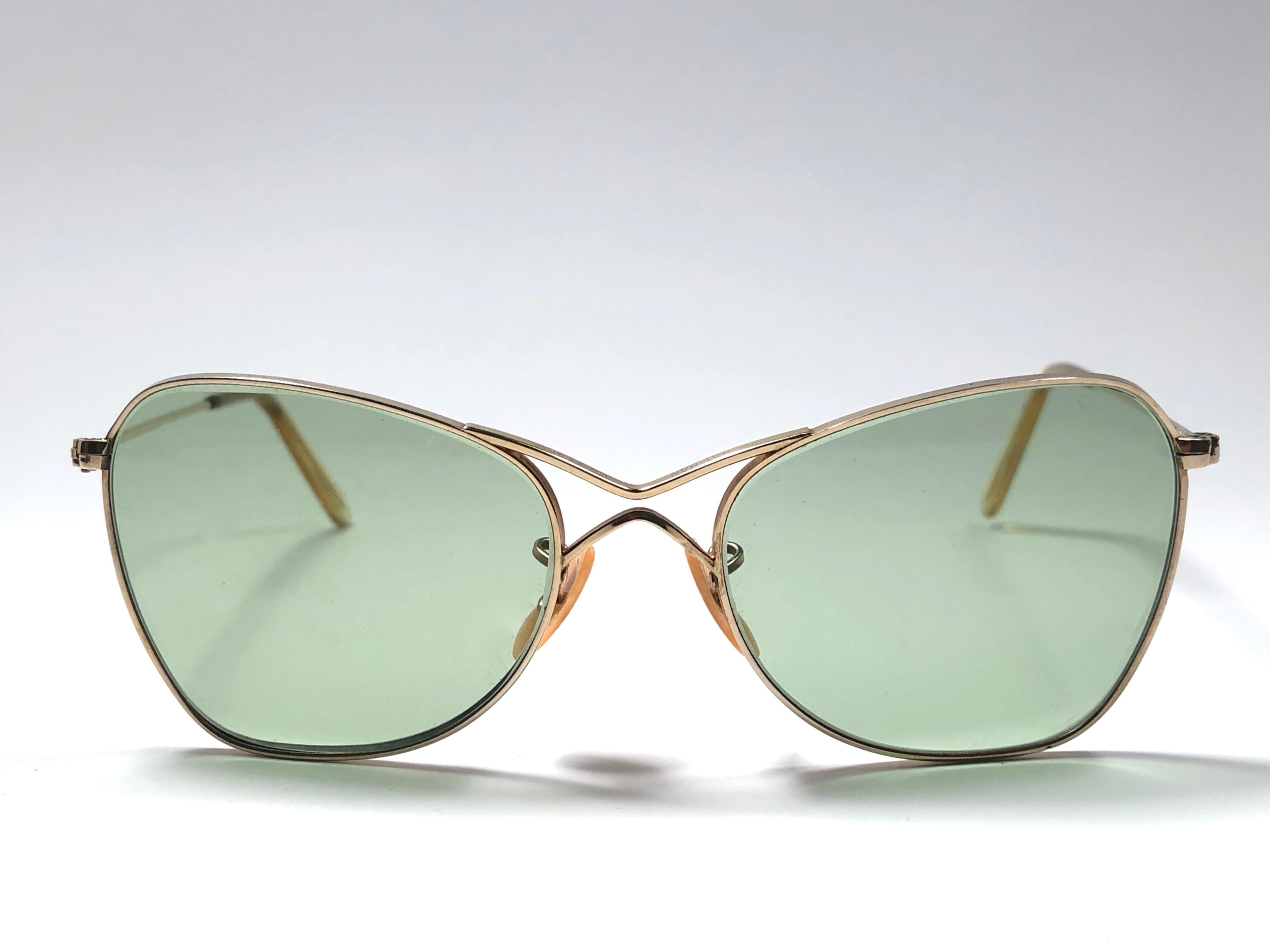 New Super special 1940's vintage Ray Ban Aviator 12K gold filled frame with light green lenses.
The smallest size available, suitable for children.  
This piece is a seldom piece. A real piece in sunglasses history.