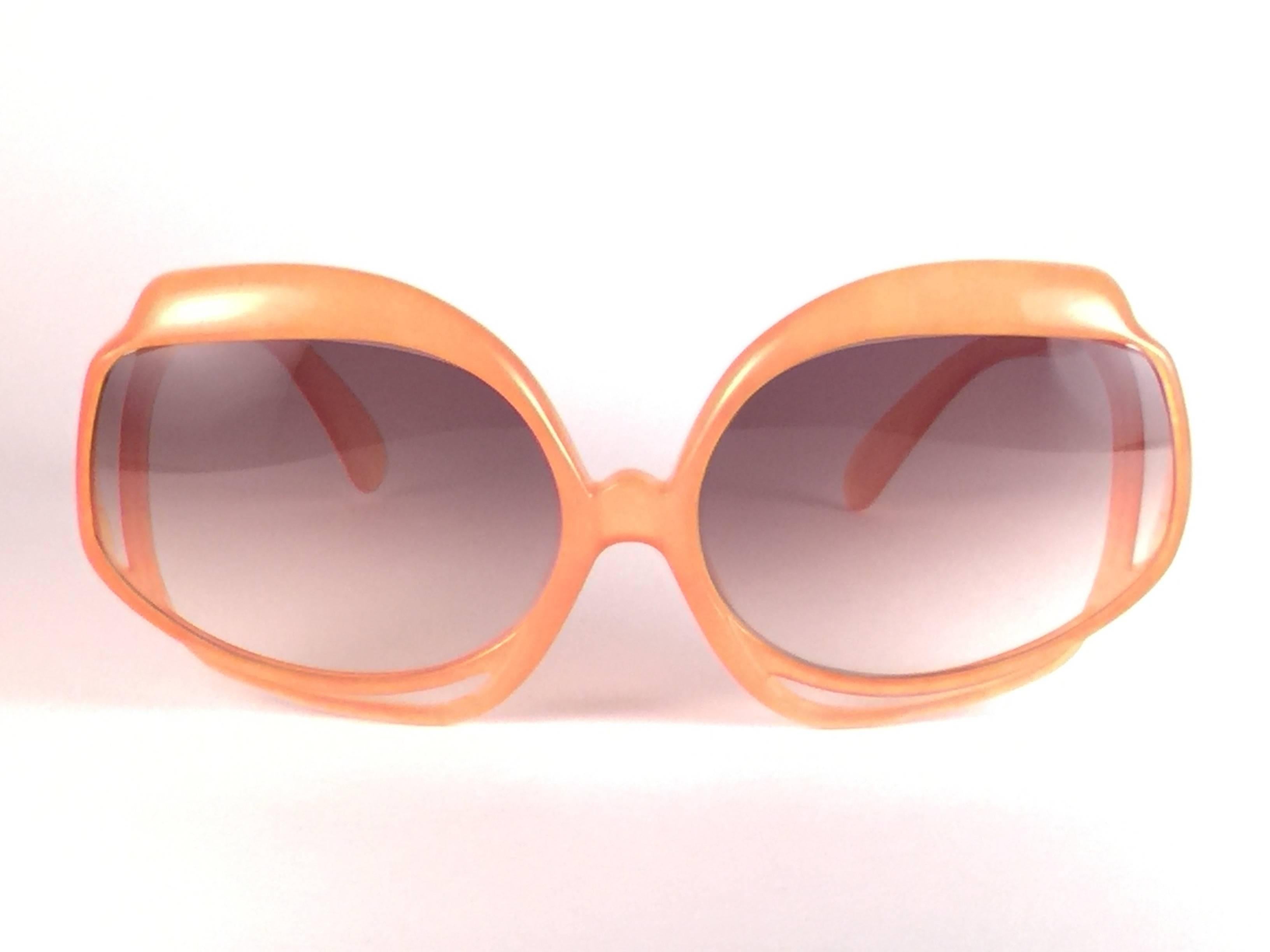 New Vintage Christian Dior 2026 30 tangerine frame with spotless light brown gradient lenses.   
Made in Germany.  
Produced and design in 1970's.  
A collector’s piece!  
New, never worn or displayed.
Comes with its original silver Christian Dior