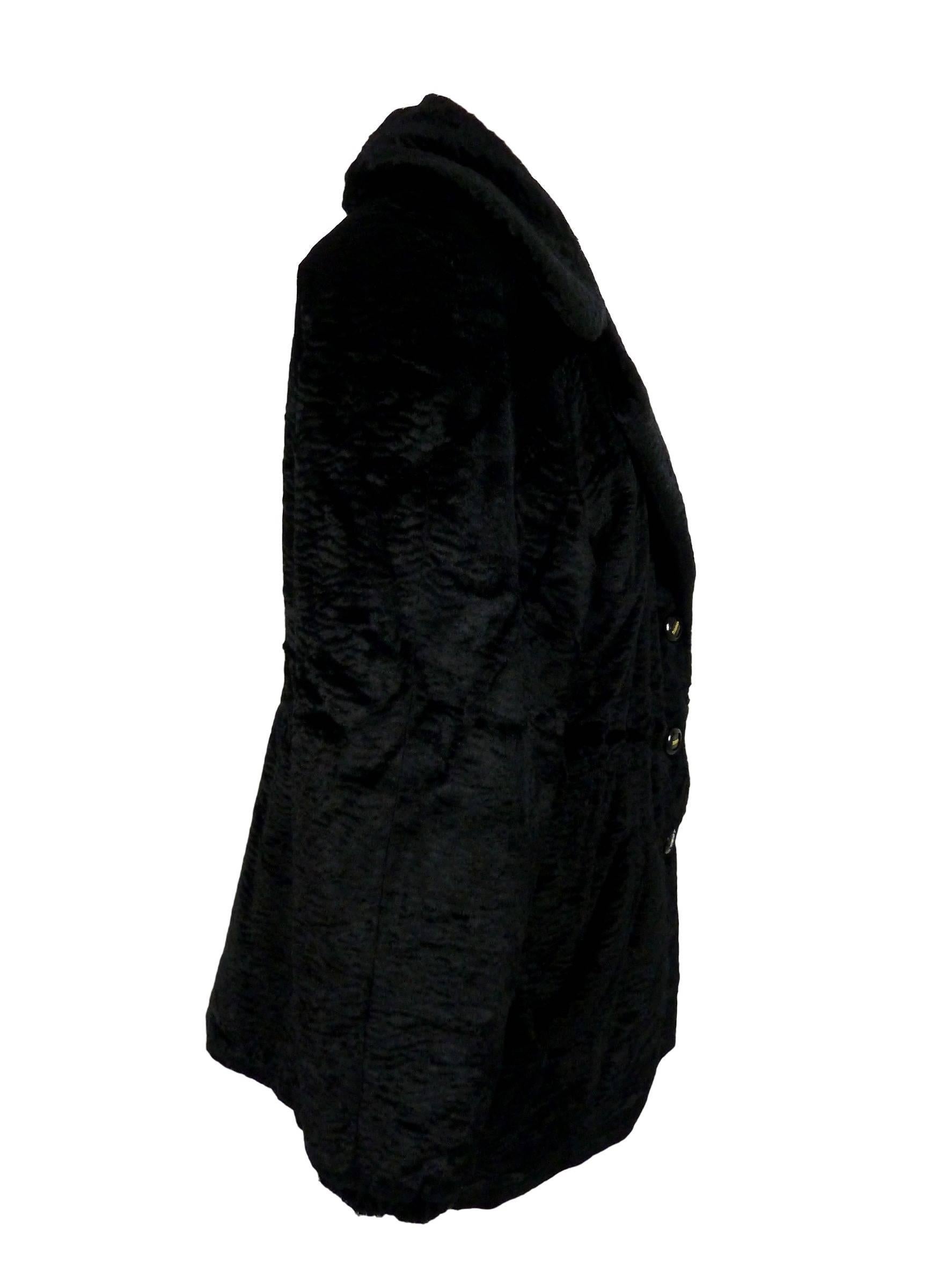 RoccoBarocco black women's fur synthetic poncho coat, close up with jewel buttons. 

Size: 46 (IT), 40 (DE/NL), 32 (US)

Shoulders: 46 cm 
Armpit to armpit: 60 cm 
Sleeves: 58 cm 
Length: 82 cm 

Composition: 55% viscose 45% cotton 
Colour: black
