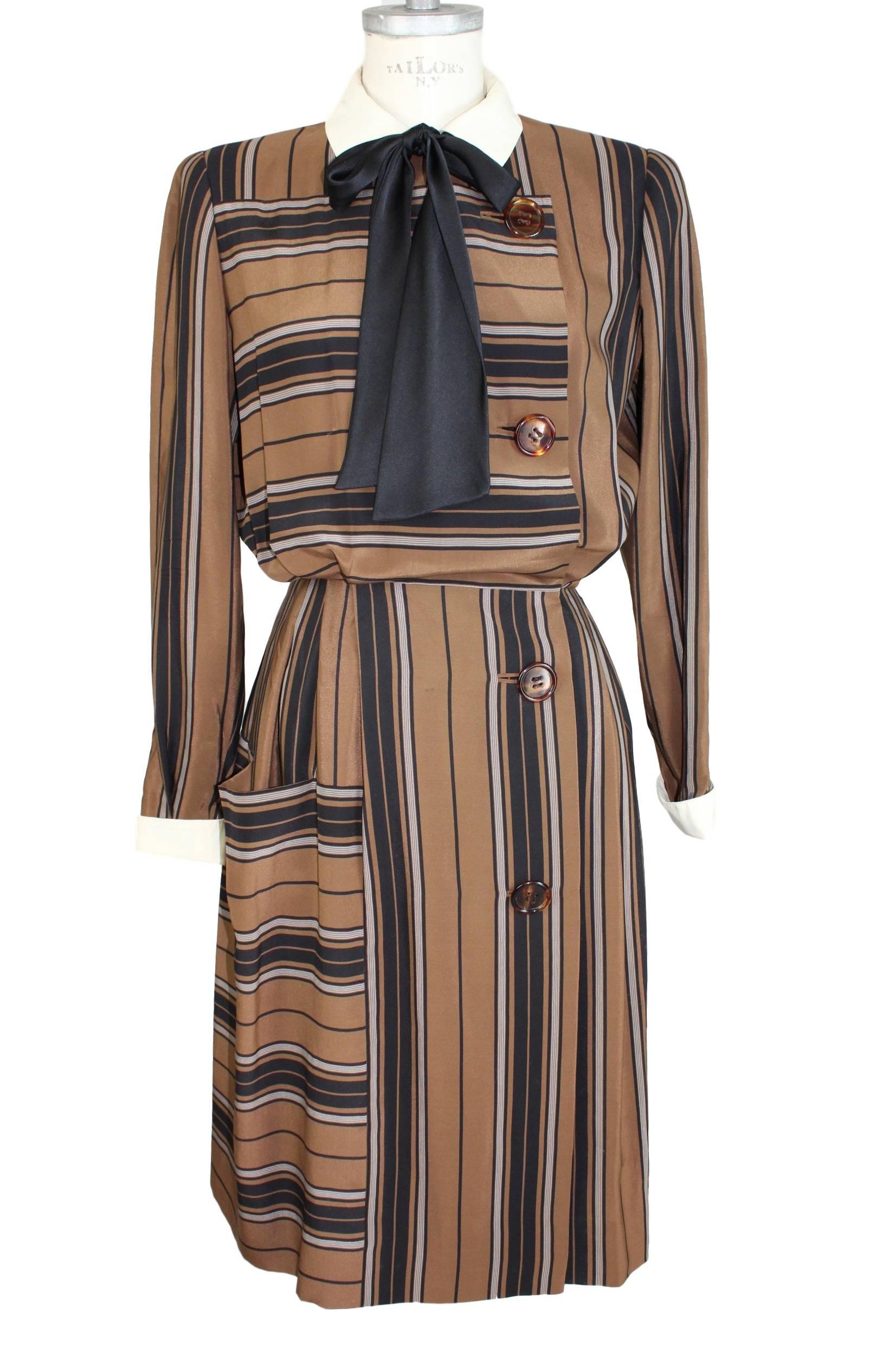 Salvatore Ferragamo dress vintage 1980s, 100% pure silk, brown and black stripes. Front pocket. The dress closes with laterally buttons and clips. Fully lined. Collar classic ivory color. Excellent vintage condition.

Size 44