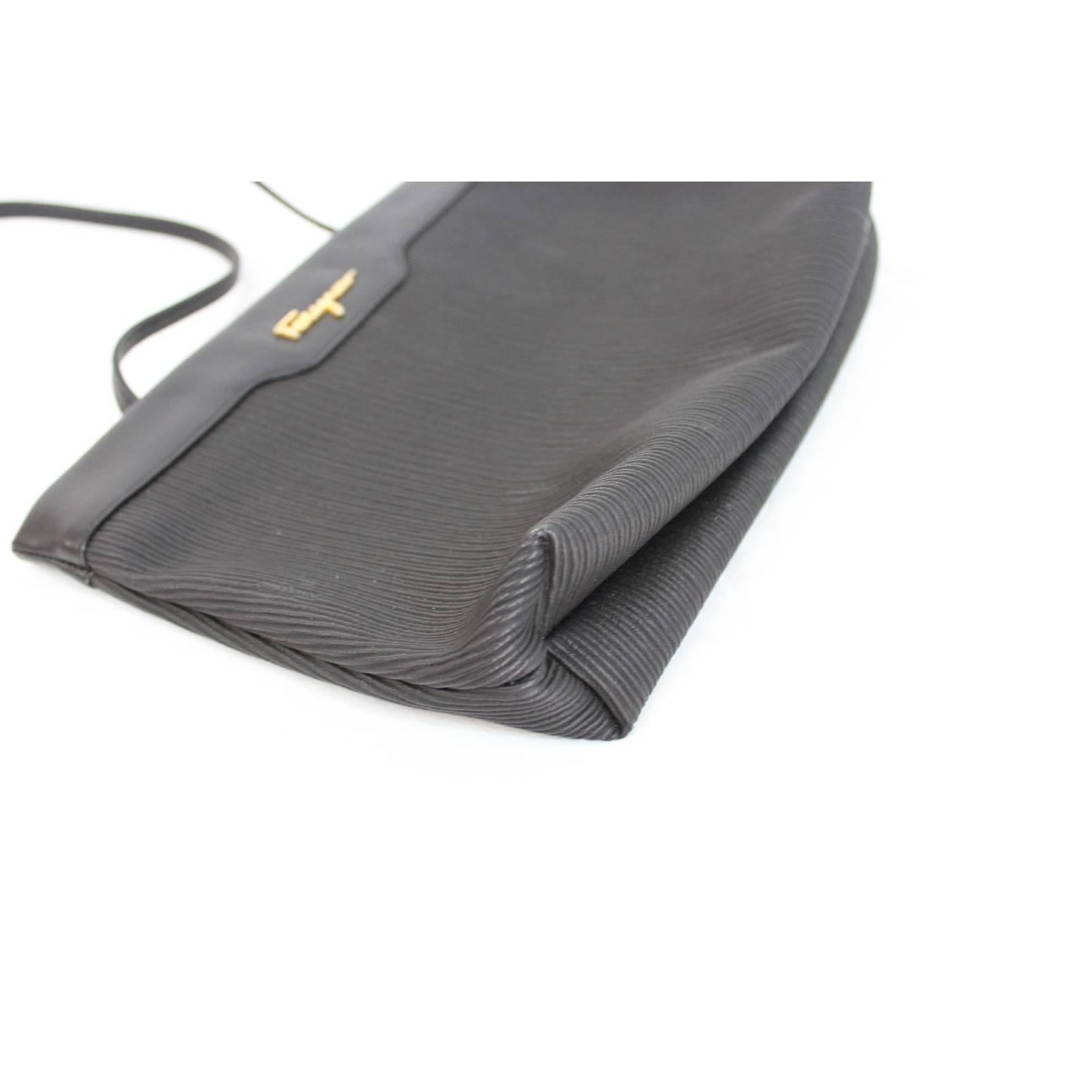 Women's Salvatore Ferragamo black leather clutch bag cod. ad 211183 made italy 1980s