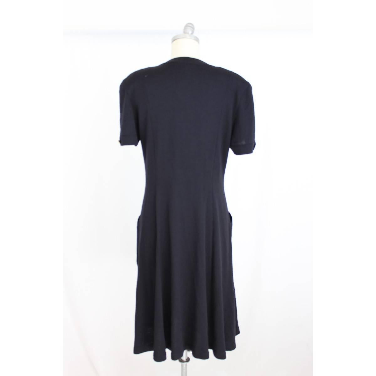 Escada by Margaretha Ley vintage pure wool black long dress, size 38 de, made germany, closure with gold buttons along the dress, two pockets on the sides, short sleeves, excellent condition.

Size: 38 de 44 en 10 Us 12 Uk

Shoulder: 46 cm
Armpit