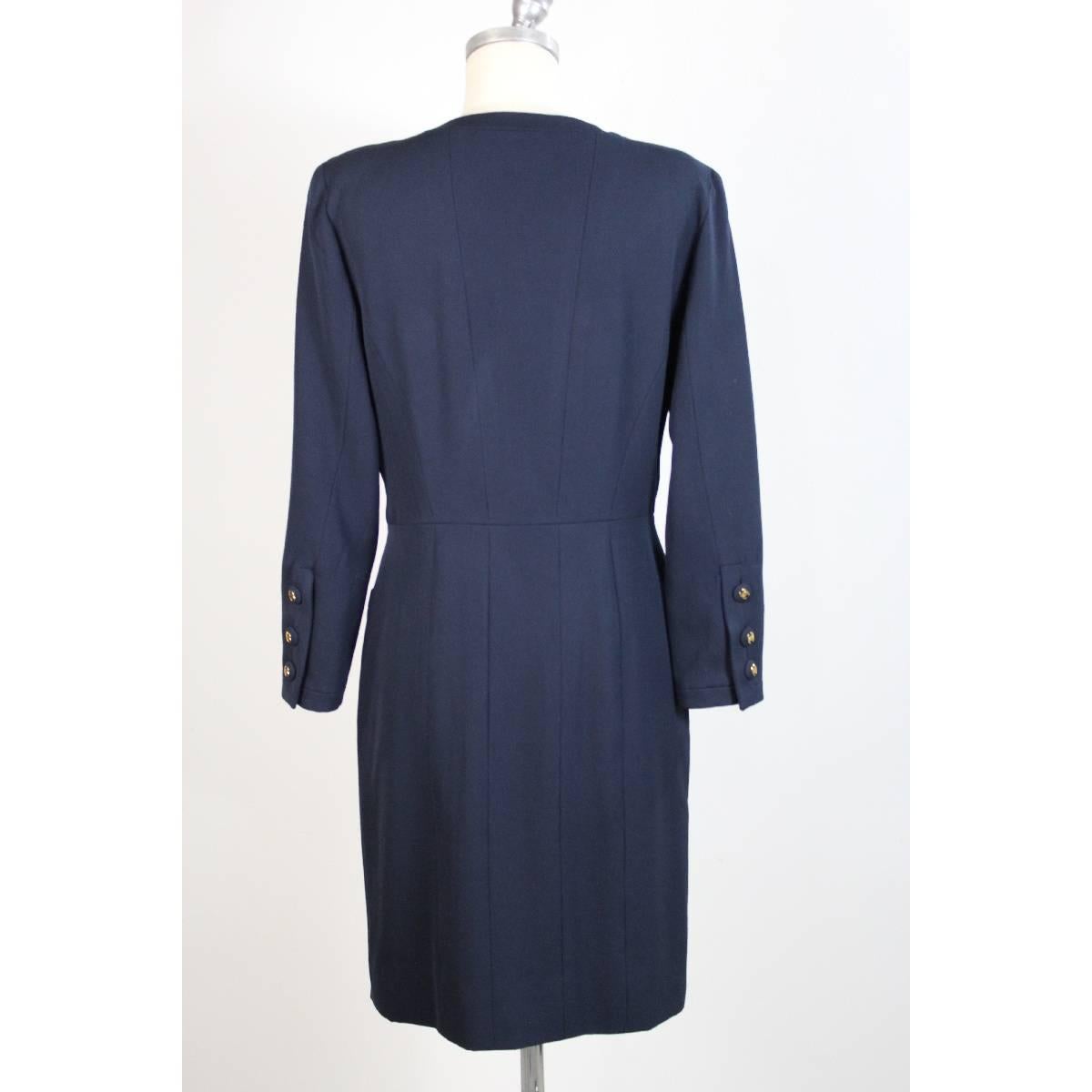 Chanel Boutique long knee-length dress, dark blue wool, placket along the dress with gold buttons logo, two pockets on the sides and two on the chest, long sleeves, size 44 it, dress lined inside with chanel logo. Excellent vintage conditions.

Size