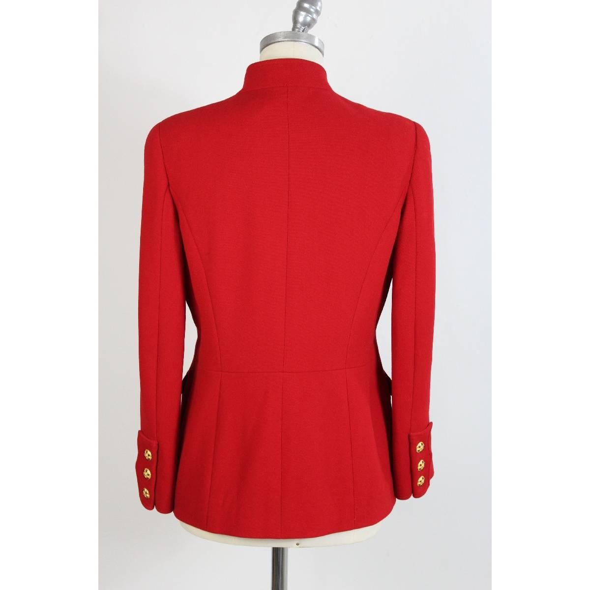 Chanel Boutique 1980s vintage 100% pure wool red long jacket, there are two pockets on the chest and two on the sides, inside lining with logo, closing with gold jewel buttons, size 42 made france, excellent conditions like new. The purchase price