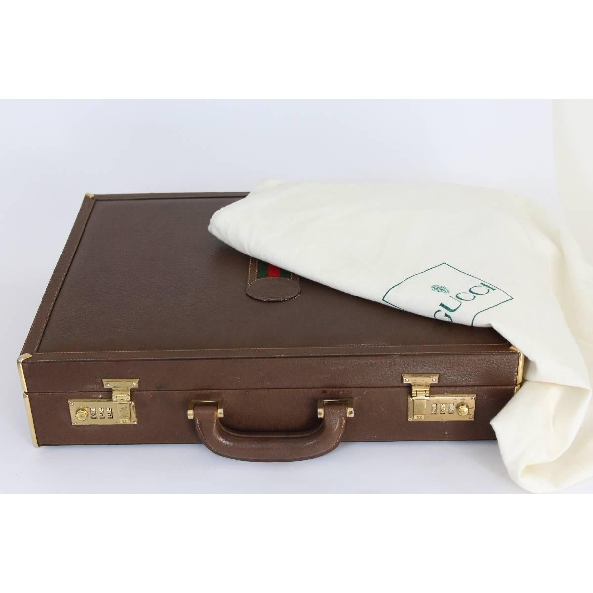 Gucci briefcase in brown leather with golden brass profiles. The two closures are working with secret code. Produced in the 70s. In excellent vintage condition. Inside there are several leather compartments, for documents and pens. The internal and