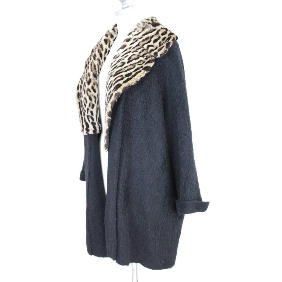 Gianfranco Ferrè vintage jacket for women. In very warm and precious angora wool. The leopard fur collar. The fit is like poncho, without buttons. Black, made in Italy, size 44. Excellent vintage condition.

Size 44 It 10 Us 12 Uk 38 Fr 40