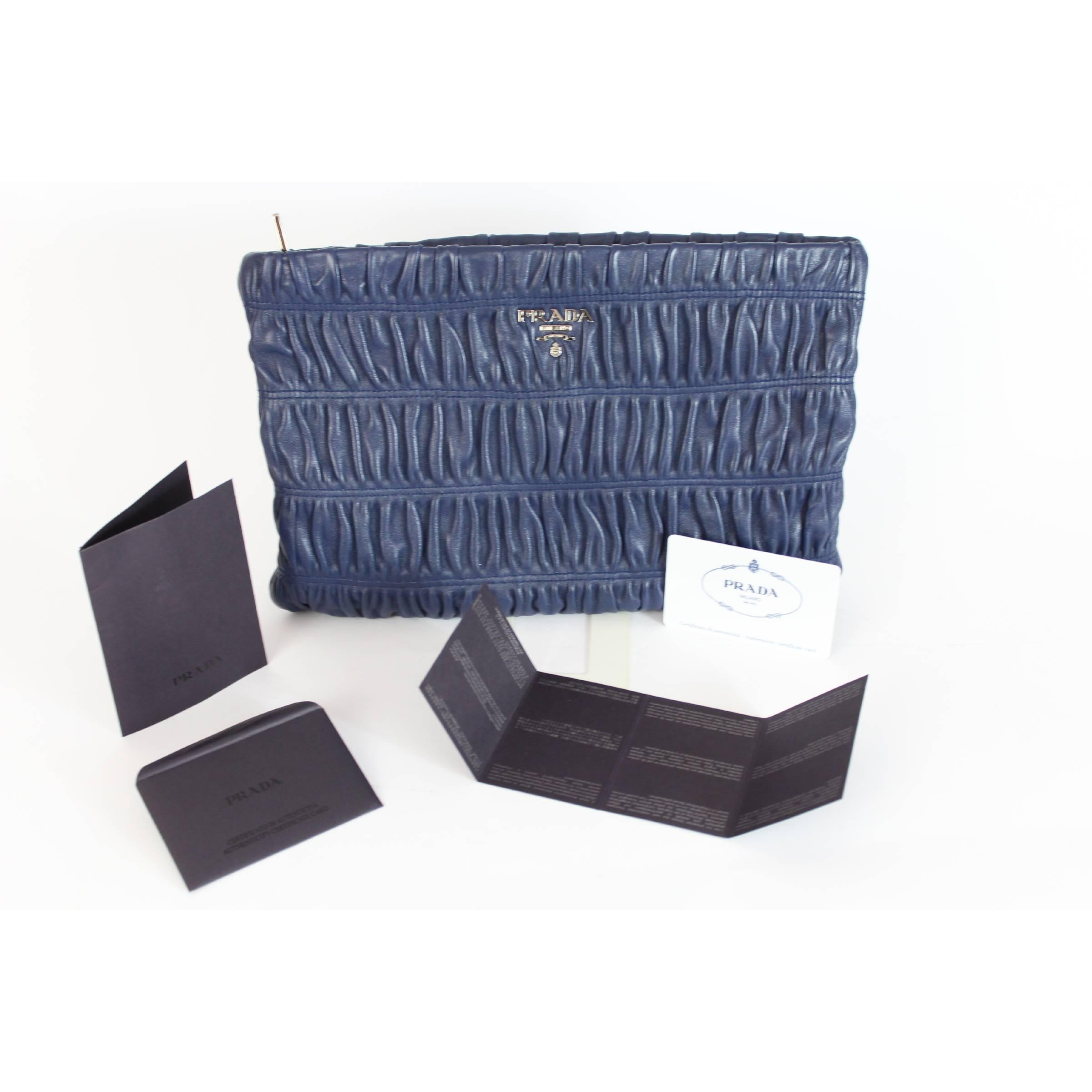 Handbag Prada model Nappa Gaufrè, blue, 100% lamb leather. Soft pochette with zip closure, inside there are pockets and dividers all in leather. Made in Italy. Code: BP0624. There is an original dustbag and a certificate of authenticity. Year